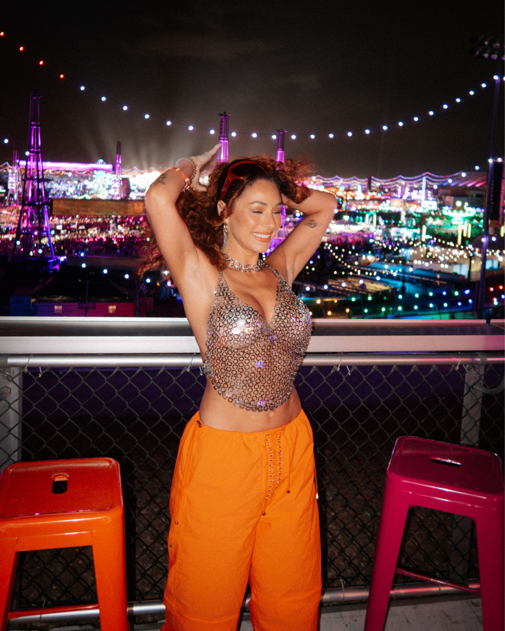 EDC Las Vegas music festival outfit ideas inspo concert look for style petite revolve chain top wolfe and badger khela orange cargo pants silver. Orange sunglasses #ltkfestival 

#LTKSummerEdit #LTKStyleTip #LTKU
