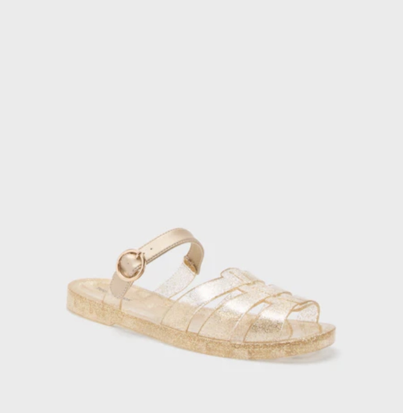 Inspired by the vintage style we all know and love, the Riley Jelly Sandals are an elevated upgrade. These slides feature a fisherman style toe with an adjustable leather arch strap. Easy and effortless, we are pairing these with denim shorts and a tee for weekend lunch or with a bathing suit on our way to the beach.

Our Favorite Details:
Open toe
Fisherman style upper
Adjustable arch strap with buckle closure
Slip-on style
Glitter design 
Water-resistant synthetic leather @Tuckernuck 

Material: Rubber, Synthetic Leather

#LTKdayinmylife #LTKSaleAlert #LTKSwim