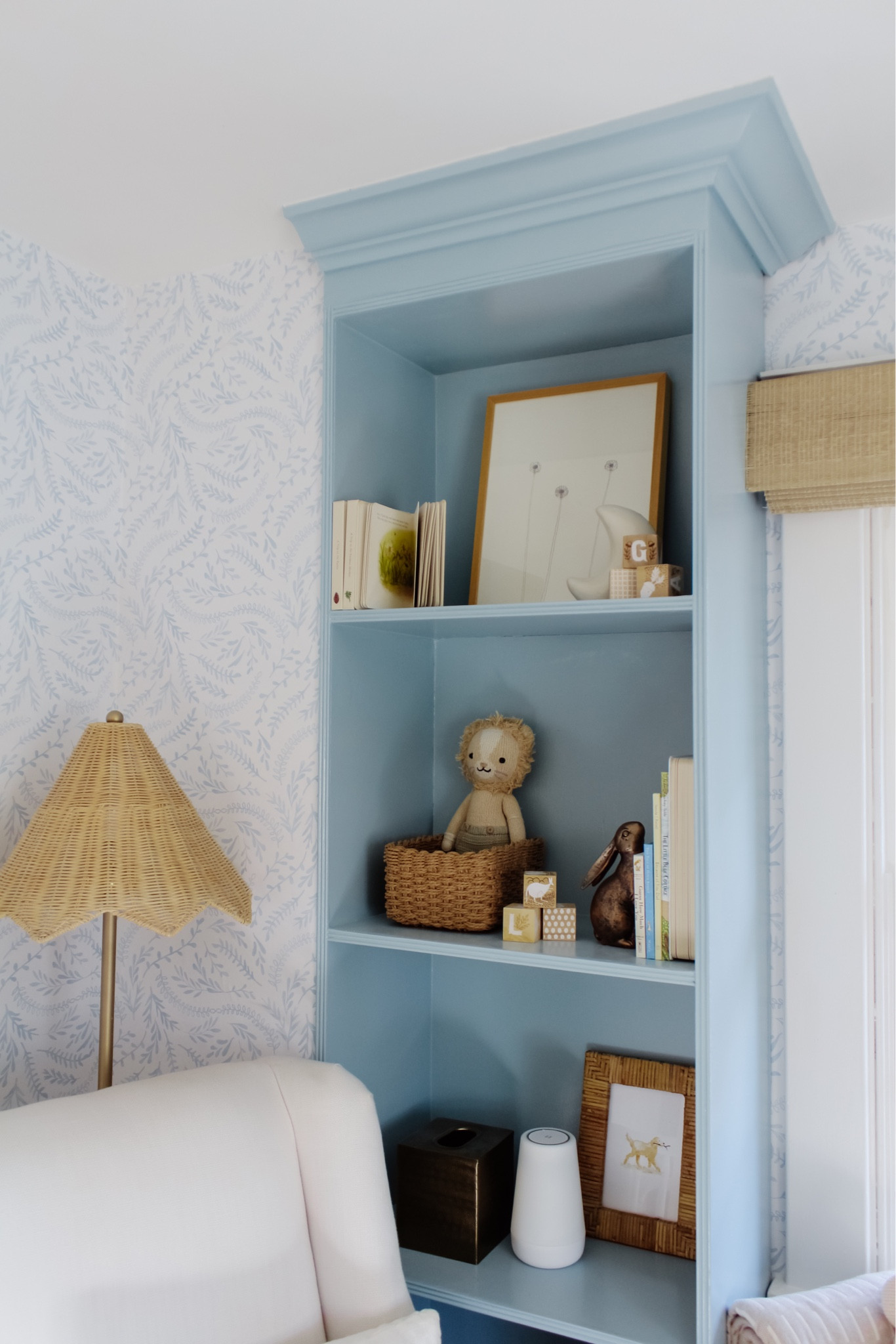 Shop the entire nursery suited for a boy or a girl, full of affordable accents over on the blog! Search Nursery Reveal
•
Shop my home, read the blog, inquire about design services and much more via the link in bio. Message me with any questions!
•
•
•

baby nursery, blue wallpaper, white crib, glider, neutral loloi rug, soft rug, Roman shades, nursery design, nursery decor, woven hamper, crib skirt, gender neutral nursery, calm nursery, pouf, brass mirror, nursery shelf decor, changing table, woven changing basket, rabbit mobile, baby mobile, hutch
#nursery #nurserydecor #nurseryinspo #nurserydesign #nurseryinspiration #babyroomdecor #babyroom #neutralnursery #genderneutralnursery #homedecor #wallpaperwednesday #homedesign #potterybarn #glider #crib #maternityshoot #maternityphotography #ltkhump #ltkbaby 
#pregnancyannouncement 
#liketkit  Shelf decor 

#LTKsalealert #LTKhome #LTKunder50