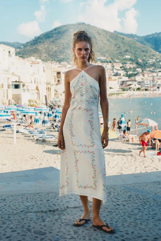 Midi dress made of linen. Halter neck with adjustable thin straps. Interior lining. Back hidden i... | Zara US