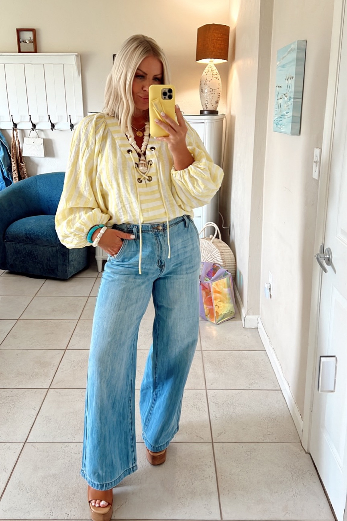 Coastal causal in this puffy sleeve dolman from Anthropologie with platform sandals + flare jeans.💛

#coastal #coastalstyle #flarejeans

#LTKstyletip #LTKsalealert #LTKover40
