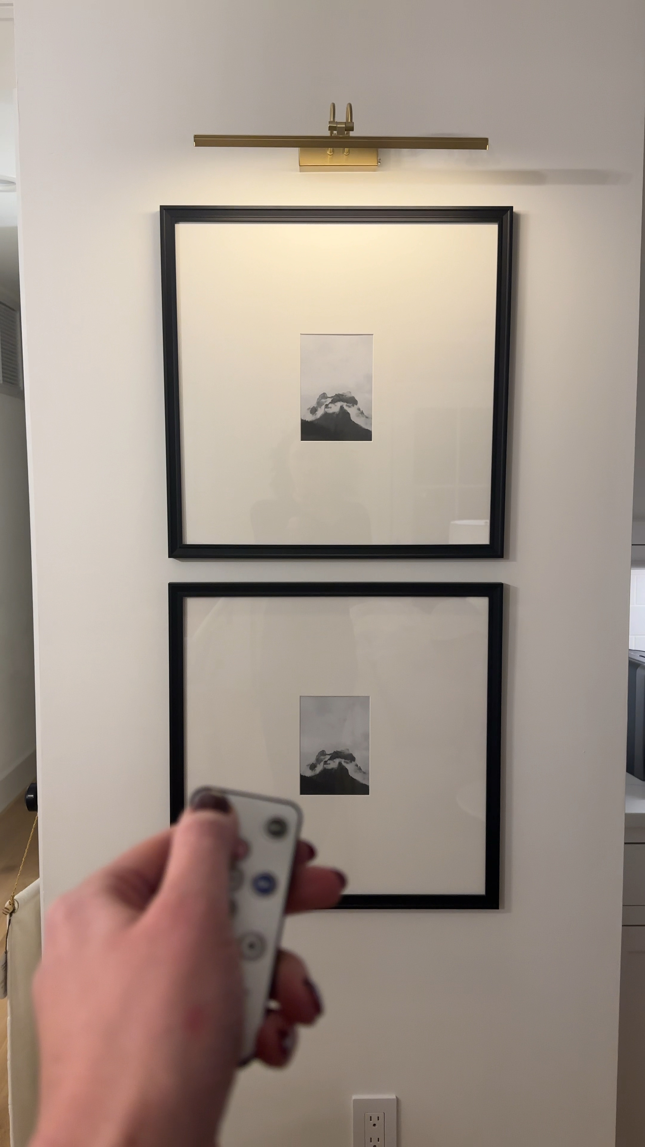 Black gallery frames with battery powered brass picture light. This is the brass finish and is on sale for Black Friday!

#LTKCyberWeek #LTKhome #LTKVideo