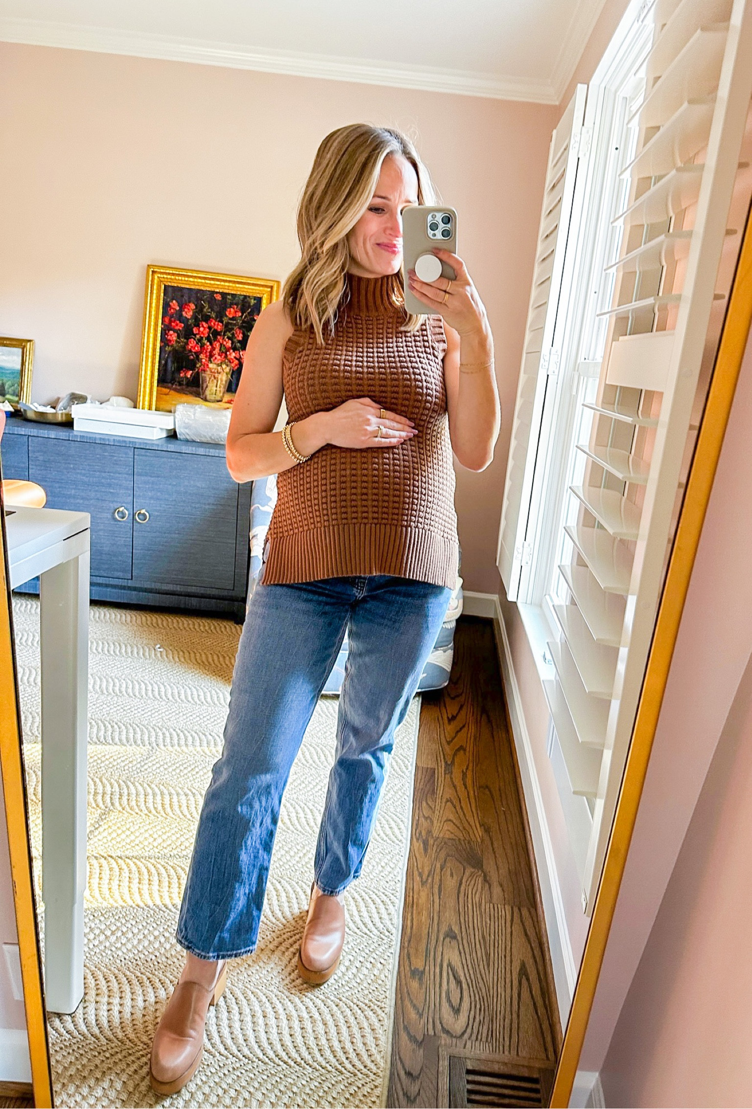 I love this old sleeveless sweater from French Connection so much. I found a few sizes left in the darker color way, but I also linked some similar options that are fully stocked. My jeans are the Abercrombie Maternity jeans, which are AMAZING because they come in the same styles as the regular jeans. I wear my pre-pregnancy size in these (but in the short length). My heeled mules are Madewell and fit TTS. #maternityoutfit #sleevelesssweater

#LTKbump #LTKshoecrush #LTKSeasonal