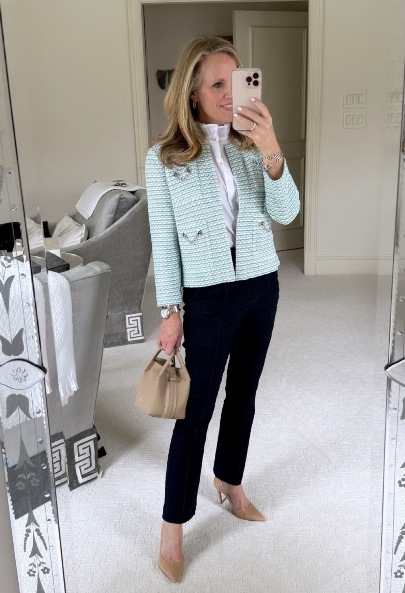 Heading to the kickoff luncheon for the Tanya Foster x Ming Wang clothing collaboration

I love this Tanya Foster x Ming Wang cropped knit lady jacket with silver chain detail 
Paired it with a sleeveless white blouse with ruffle neck detail 
Dark trouser cut denim from Veronica Beard 
Loro piana Bale bag 
Nude Stewart Weitzman heels 

#LTKSeasonal #LTKStyleTip #LTKOver40