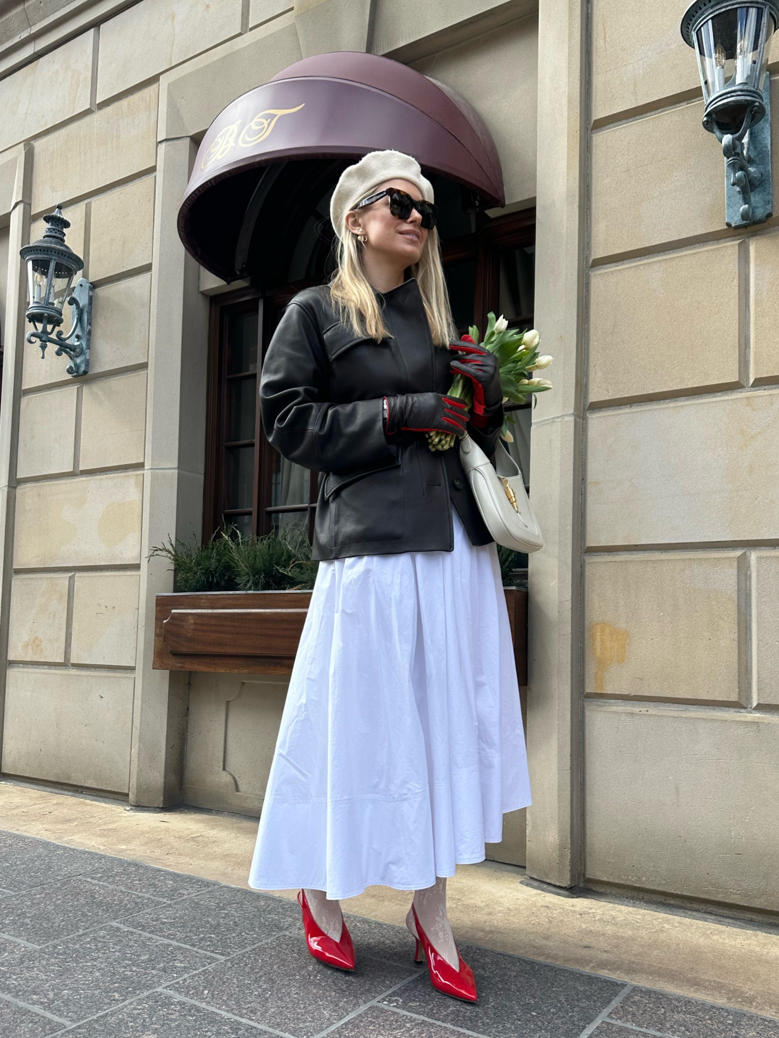 White crispy long skirt with a leather jacket. Feminine and stylish. Oh, and a pair of red sling backs and gloves to add some accent to the look. 

#LTKSeasonal #LTKstyletip #LTKshoecrush