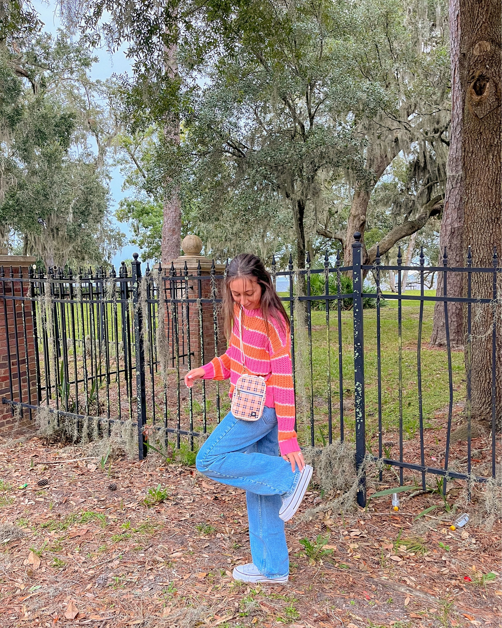 casual fall outfit; pink and orange striped sweater, abercrombie denim jeans, converse, thread wallets crossbody bag