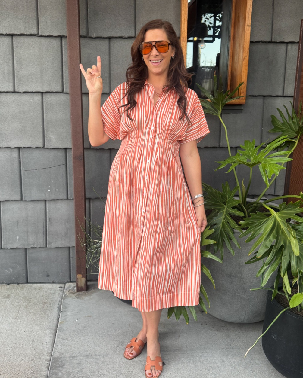 Happy #longhornfriday! Today’s look is this $32 dress (reminds me of fruit striped gum and I love it!)  paired with $14 @amazon sunnies and @hermes shoes. its a high/low look! ⁠ 