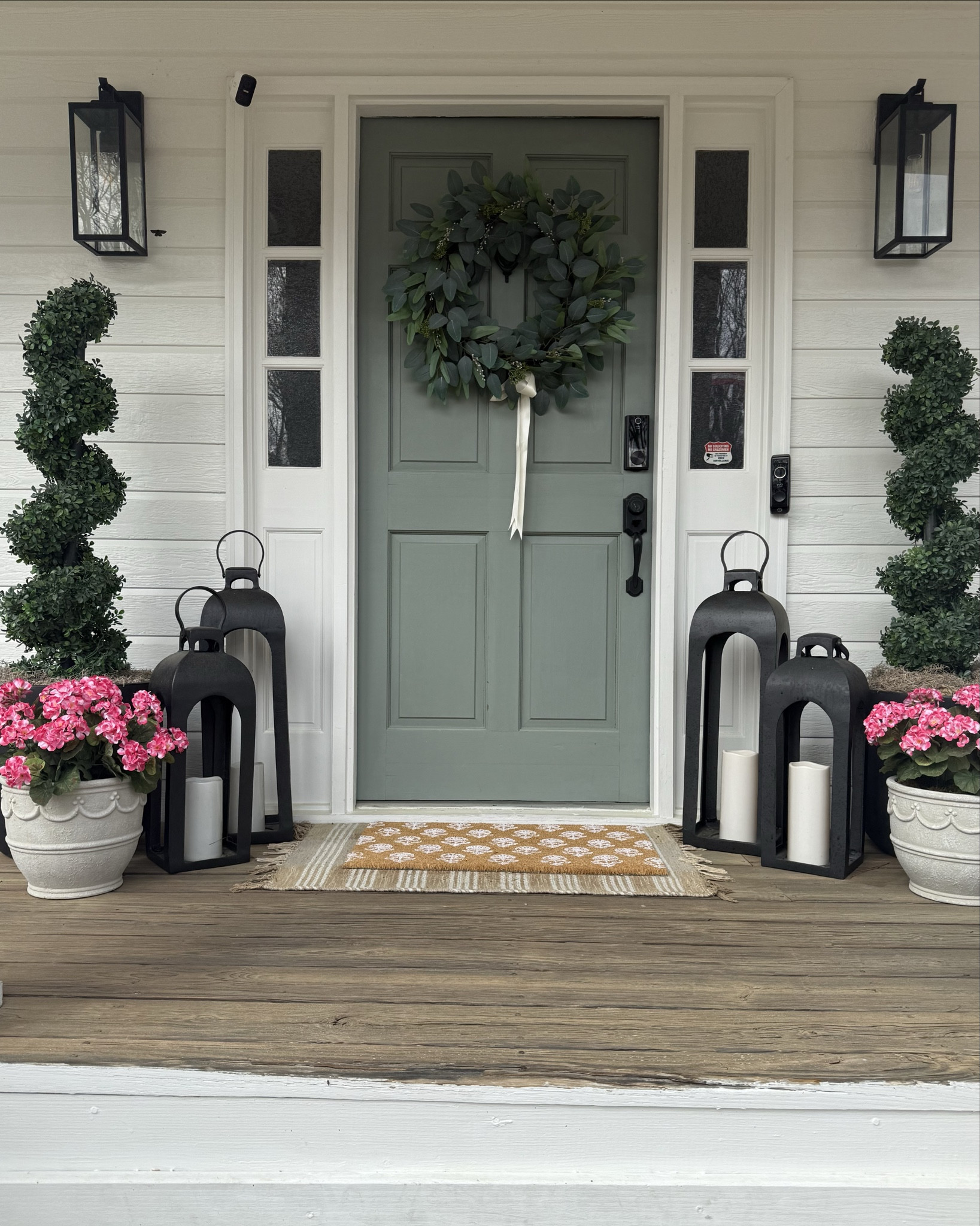 I keep the main pieces the same year round and refresh the layering mats and maybe a new (faux) floral for the season. My lanterns are back again this year, come in the black or gold and  are on sale today! 

I’ve done real plants out here before, but I always forget to water them… these UV resistant faux topiaries and florals add color to my porch and are maintenance free! 
.
House exterior: SW Pure White
shutters: SW Dorian Gray
Front door: PPG Paints Gray Heron

.
.

Front porch styling, spring front porch, covered front porch, southern front porch, no maintenance porch 

#LTKmomlife #LTKHome #LTKSeasonal