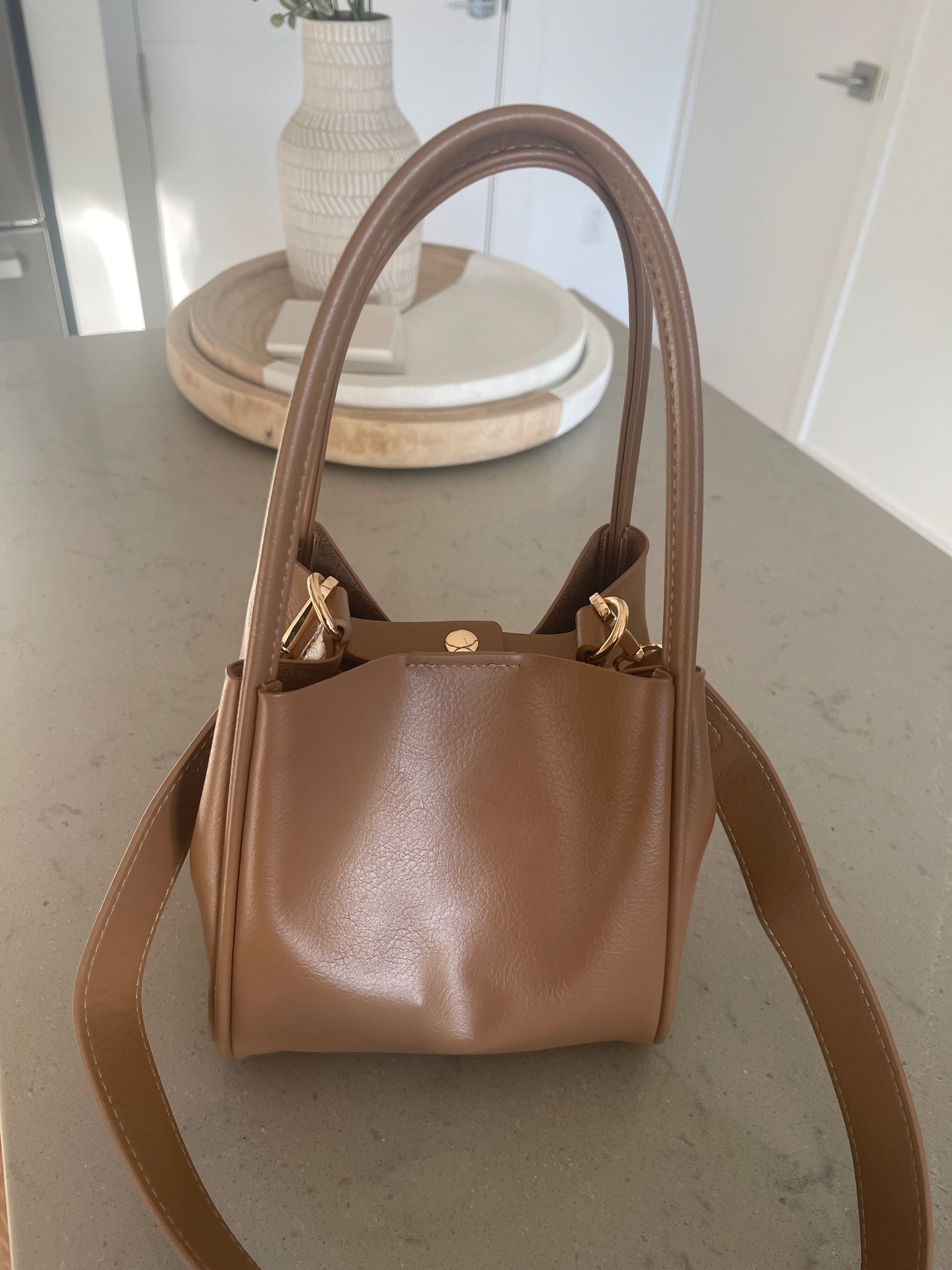 Handbag! Reminds me of Polene Paris Bags. Perfect affordable gift for a girl 

#LTKGiftGuide #LTKHoliday #LTKfindsunder100