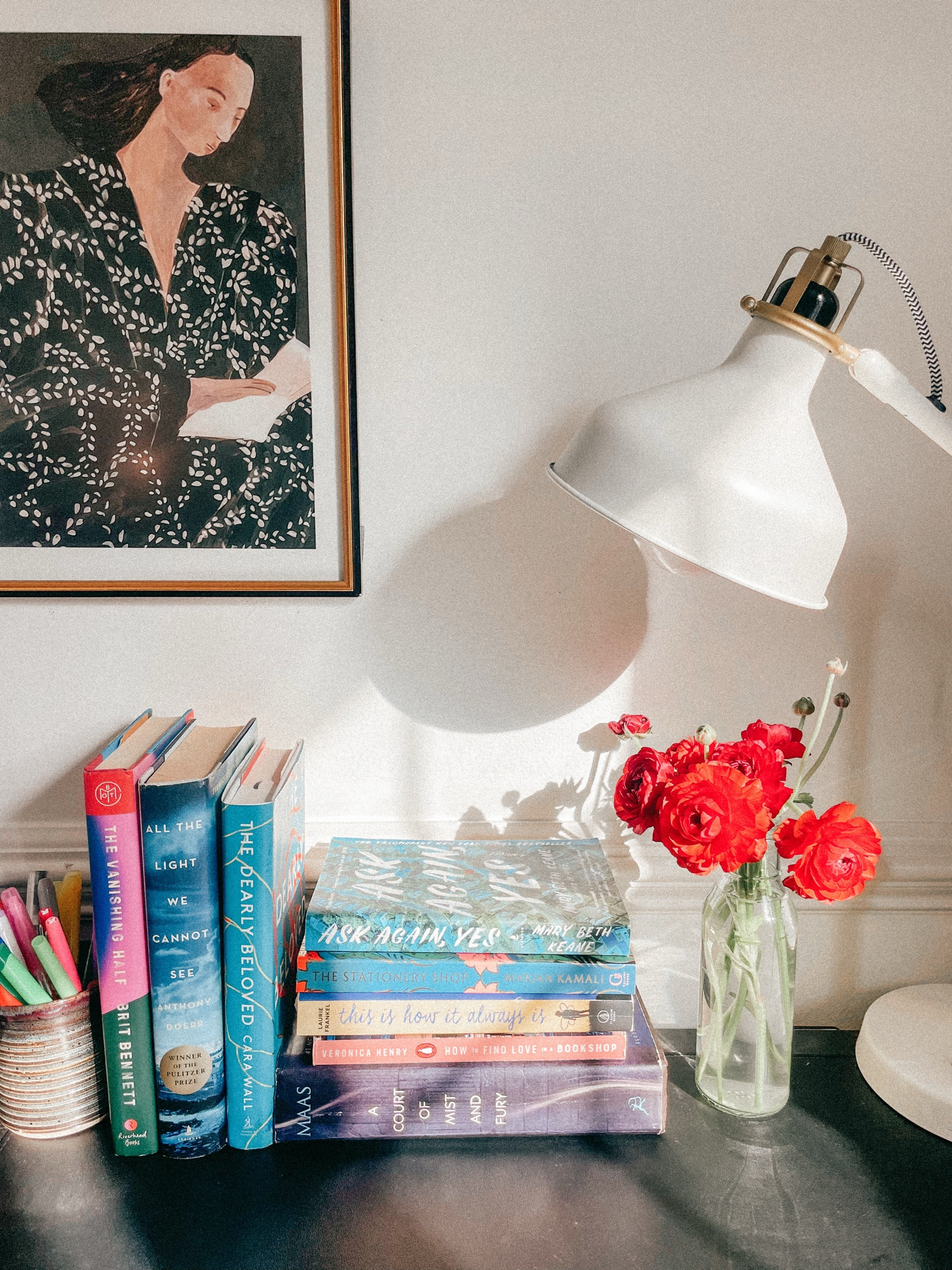 Book stacks on desk with reading woman art print framed, books and flowers



#LTKHome #LTKFindsUnder50