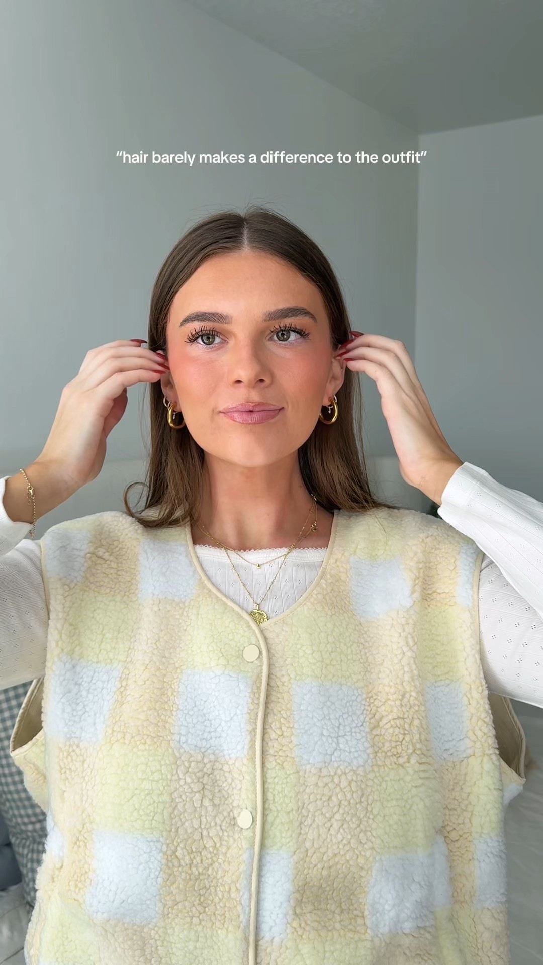 Red button up sweater, light blue half zip fleece, brown oversized sweater, blue and brown plaid print scarf, headbands