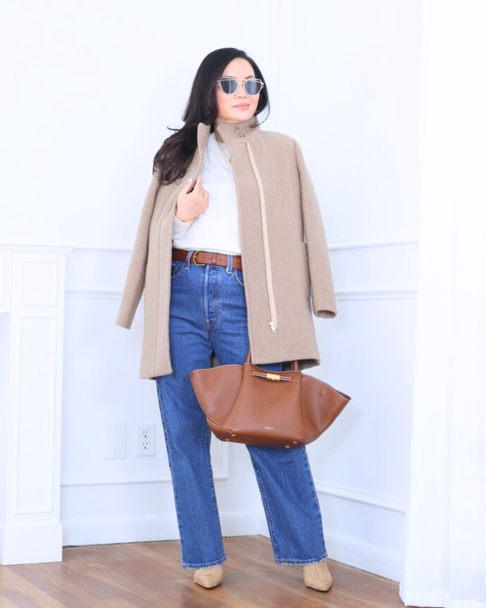 Casual winter layers I keep reaching for — wearing J.Crew Factory City Coat With Button Neck over a cozy sweater from Quince, paired with classic Levi’s jeans and booties for an effortless everyday look that keeps me warm and polished on chillier days. I’m 5’2, wearing size XS.

#LTKootd #LTKPetite #LTKOver40