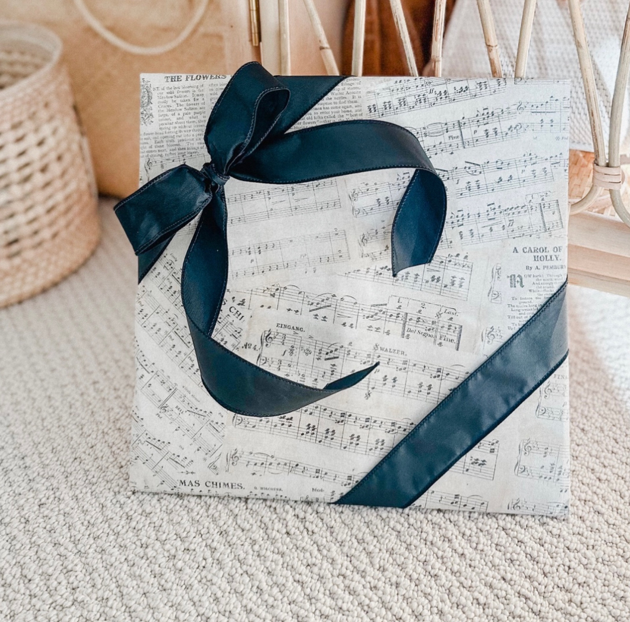 VINYL 🎶🎶 LOVE the way this wrap turned out…this paper is the cutest!! Linking something similar here. And the diagonal bow was surprisingly easy! 🎀

#LTKHoliday