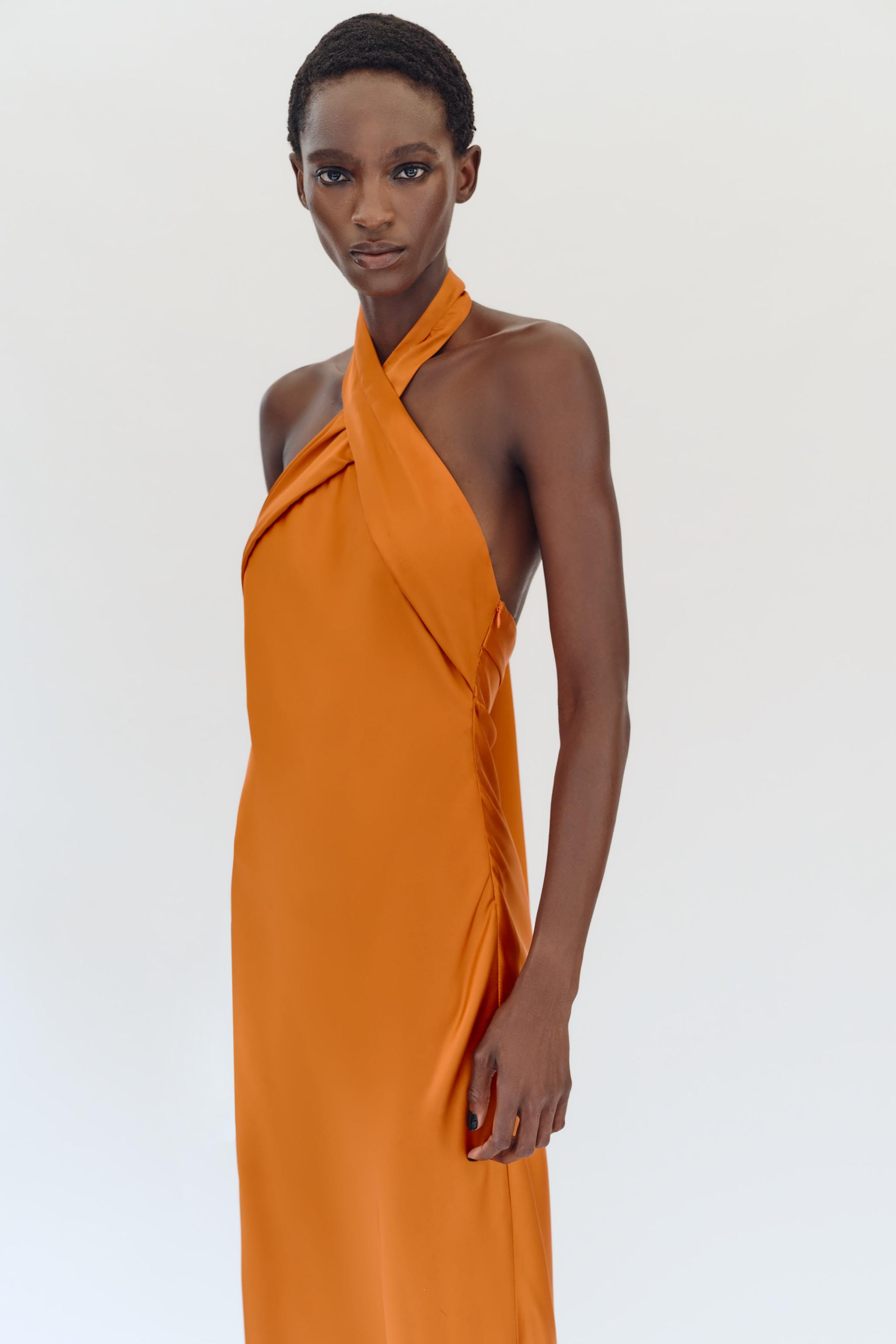 Satin dress with a crossover halter neck and an open back. Featuring a back fastening with hidden... | Zara UK