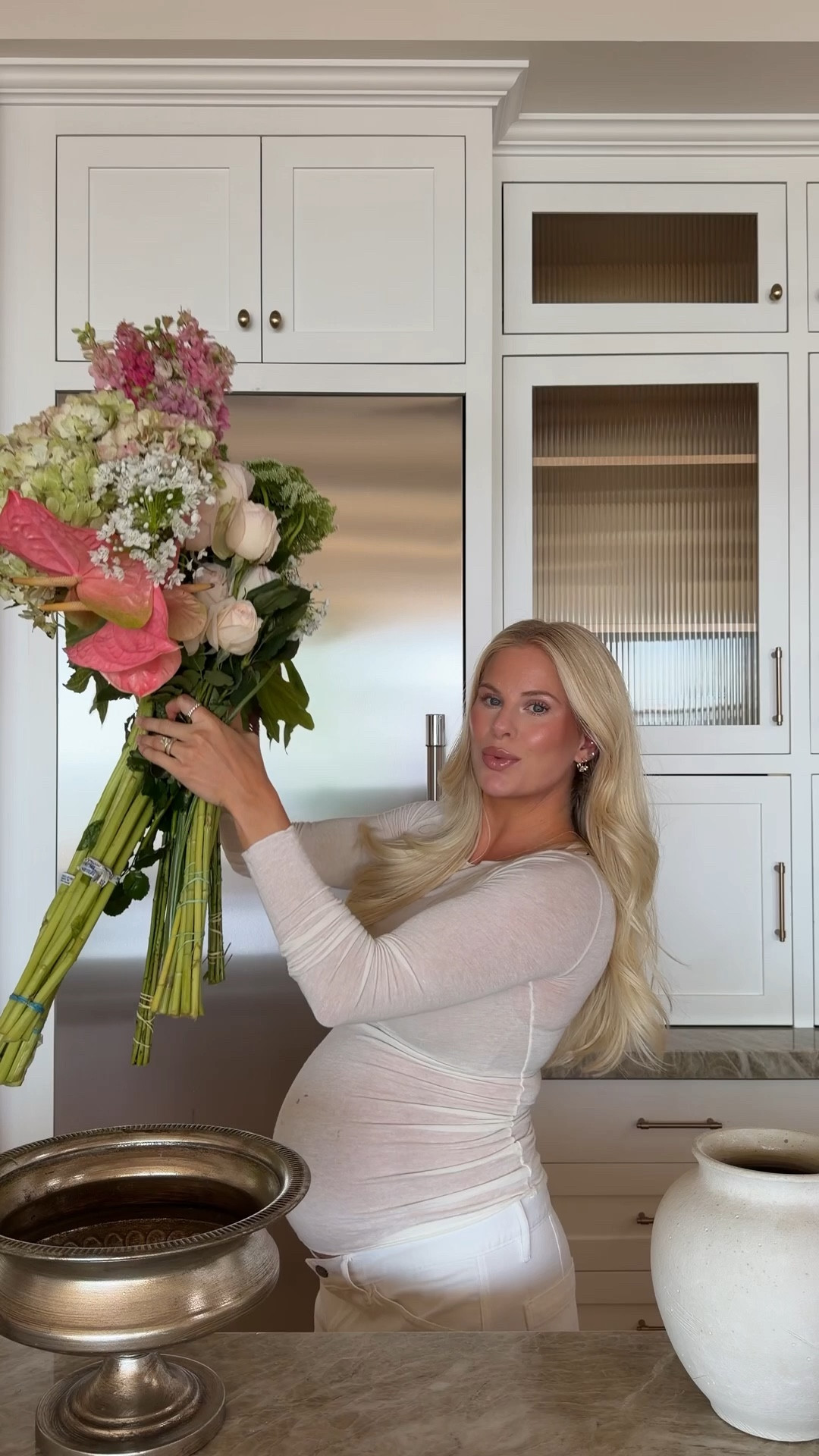 Size m in top (normally small), 32 in jeans (normally 26),  sized in both up for pregnancy 