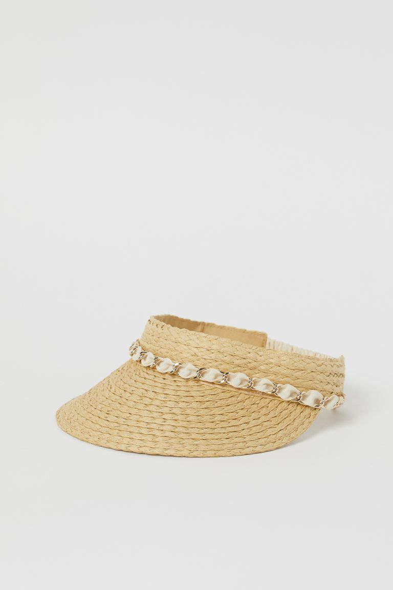 Sun visor in braided paper straw decorated with a grosgrain and metal chain band at front. Sweatb... | H&M (US + CA)