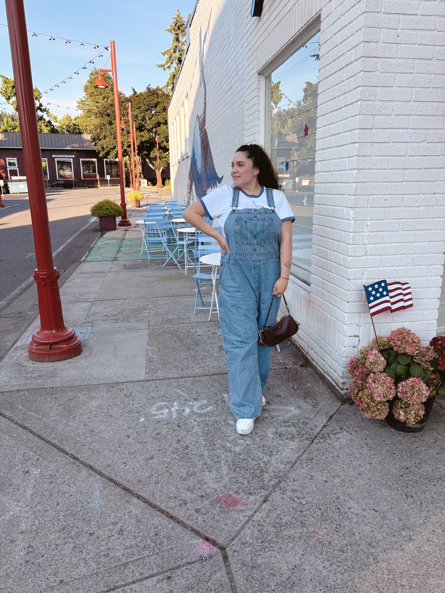 PNW mornings call for denim overalls 🤍 Styled my wide-leg denim overalls with a vintage-inspired ringer tee, white leather sneakers, and my cherry charm shoulder bag for a stroll through Olde Town Issaquah. Effortless, easy, romanticizing real life one outfit at a time.

Denim bib overalls, wide leg overalls, platform white sneakers,Brown leather shoulder bag, baguette bag, Cherry charm bag accessory, fruit charm keychain, PNW style, small town outfit, Casual mom style, everyday outfit inspo
Warm weather layering, transitional outfit

Wearing XL in both 


#denimoverAlls #overallsoutfit #wideLegOverAlls #casualstyle #everydayoutfit #ootd #outfitinspo #momstyle #millennialmom #romanticizingreallife
#LTK #LTKstyletip #LTKfindsunder100 #LTKmidsize #liketoknowit #shopmycloset

 #IssaquahWA #PNWstyle #PacificNorthwest #EastsideSeattle #SeattleBlogger #PNWlife #ExploreWashington

#slowliving #cozyoutfit #warmtones #contentcreator #styleinspo #vintageinspired #americana
#instastyle #fashionblogger #outfitoftheday #styleoftheday #dailylook

#LTKdayinmylife #LTKgrwm #LTKootd