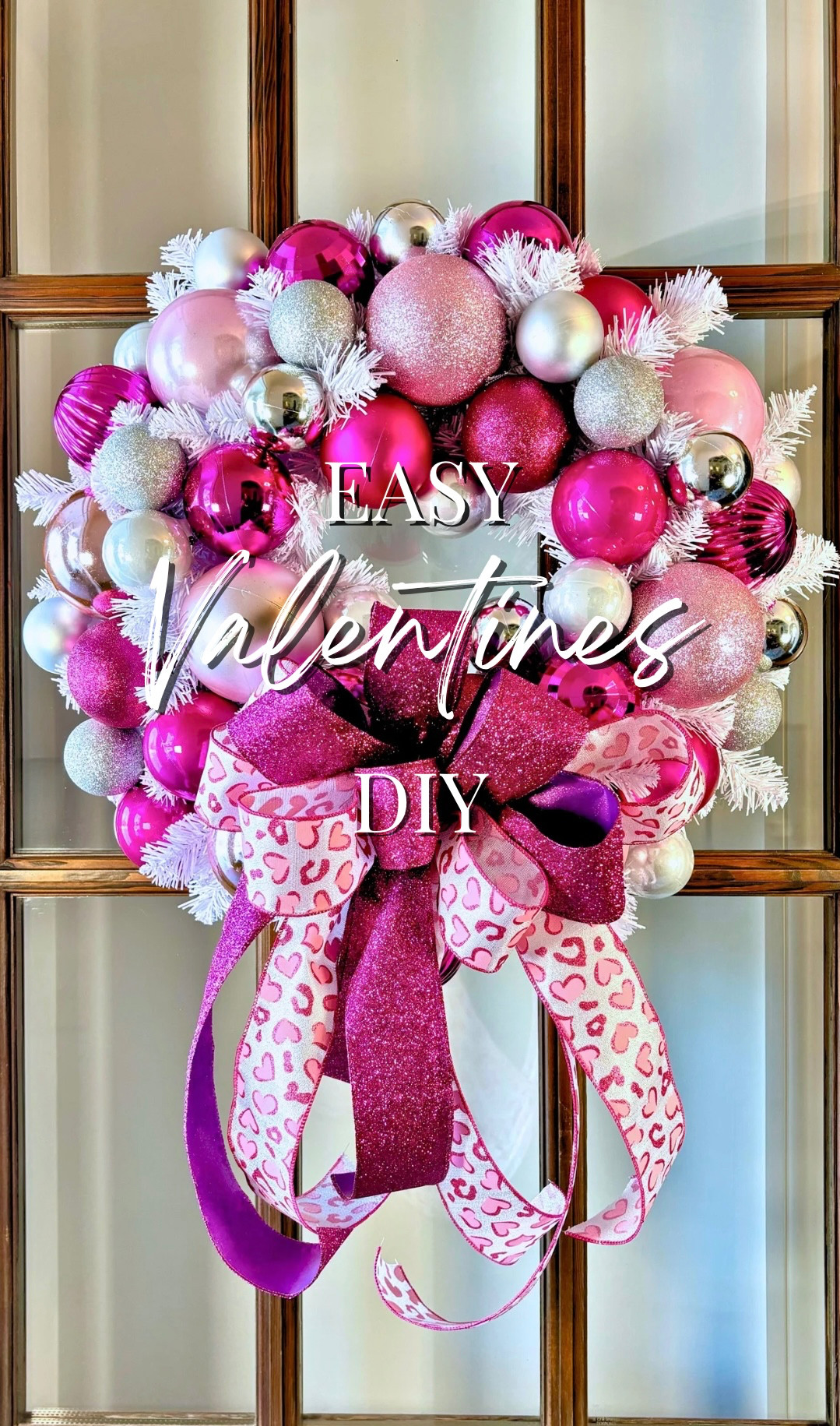 This Valentine’s wreath is so easy, yet all about the bling! I started with an iridescent base, added oversized 4” ornaments in pale glittery pinks, smaller fuchsia pops, and a little silver sparkle. And, of course, a glittery bow with pink leopard to seal the deal. 🩷🐆

It’s easy, sparkly, sweet, and a just little over the top!  I Love It!! 💕
 

 #LTKWatchNow #LTKSeasonal #LTKHome