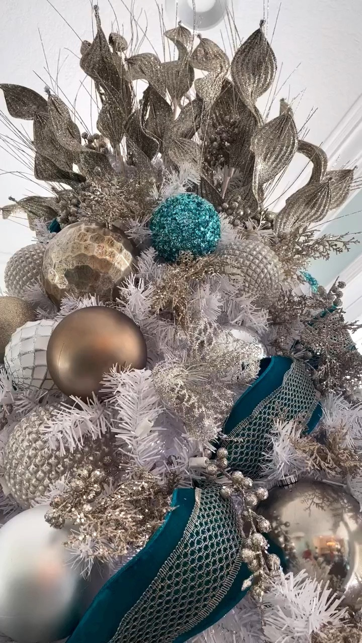 It’s all about the details. First, this ribbon. Oh gosh it’s so beautiful. 4 inch teal velvet that matches the couch in this room perfectly. I love layering an open weave ribbon so that you can still see the color through it. This combo gives a particularly classy feel. 
Always happy to help with ribbon and tree! Feel free to reach out.
.
.
.
.
.
#ribbonaddict #ribbon #christmasribbon #christmastreedesigner #holdmyeggnog #christmastreeideas #ribbontutorial #christmasribbontutorial #bluechristmas #tealdecor #tealchristmas #xmasdecor. #xmas #xmastreedecorating #xmastreedecoration #christmasdecorations #christmastreeinspo #christmastime #christmasinspiration #christmasmood #helloholidays #christmastipsanddecor #christmasdecoratingtips #christmasinflorida #teal #ltkchristmas#LTKxWayfair 

#LTKSeasonal #LTKHome
