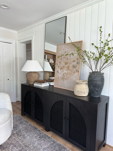 Console table, media table, black table, faux stems, vases, lamp, mirror, neutral home decor, accent chairs, styling books 

#LTKHome #LTKStyleTip