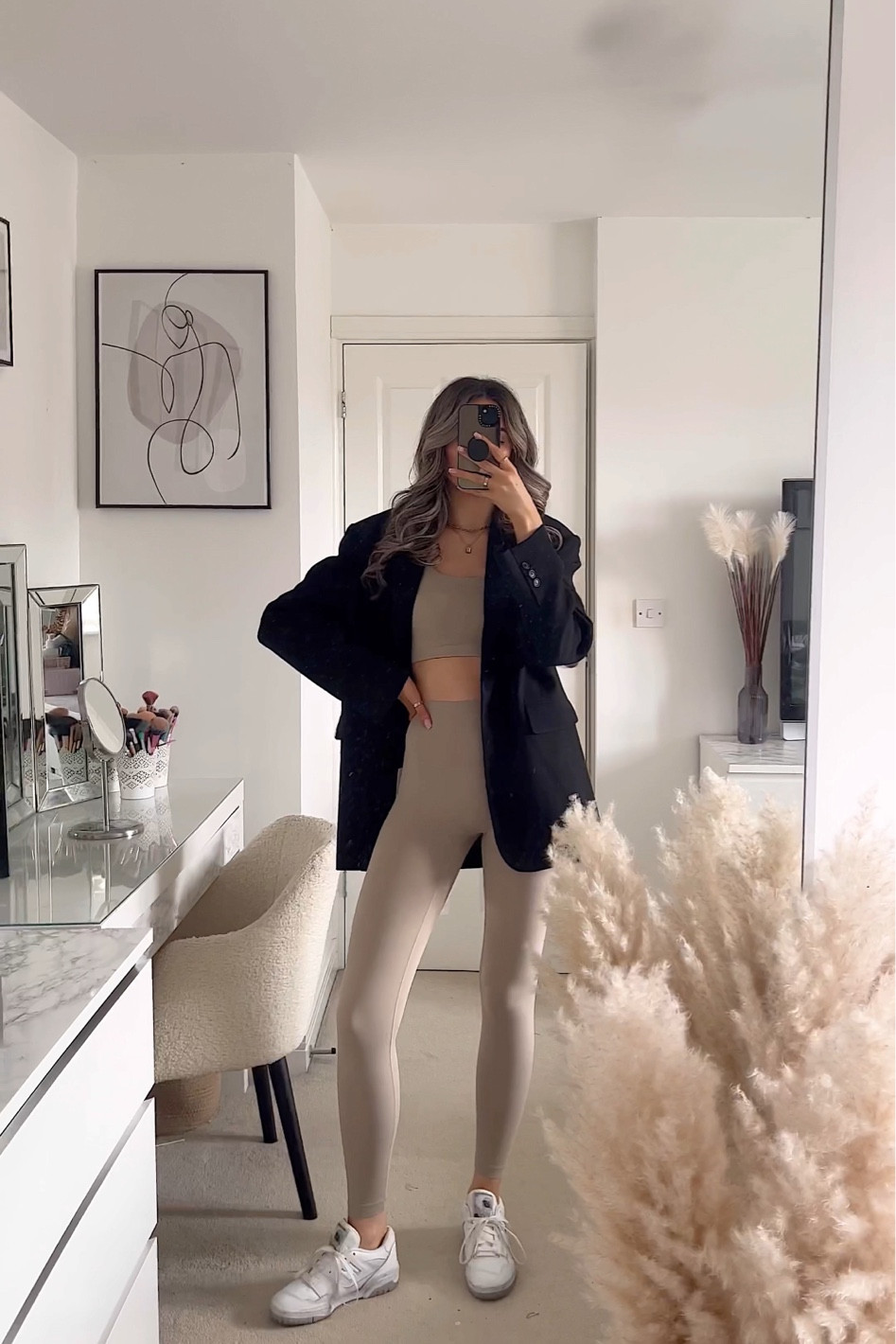 Casual outfit, beige sports top, beige leggings, black oversized blazer, new balance trainers. 

#LTKSeasonal #LTKstyletip #LTKfit