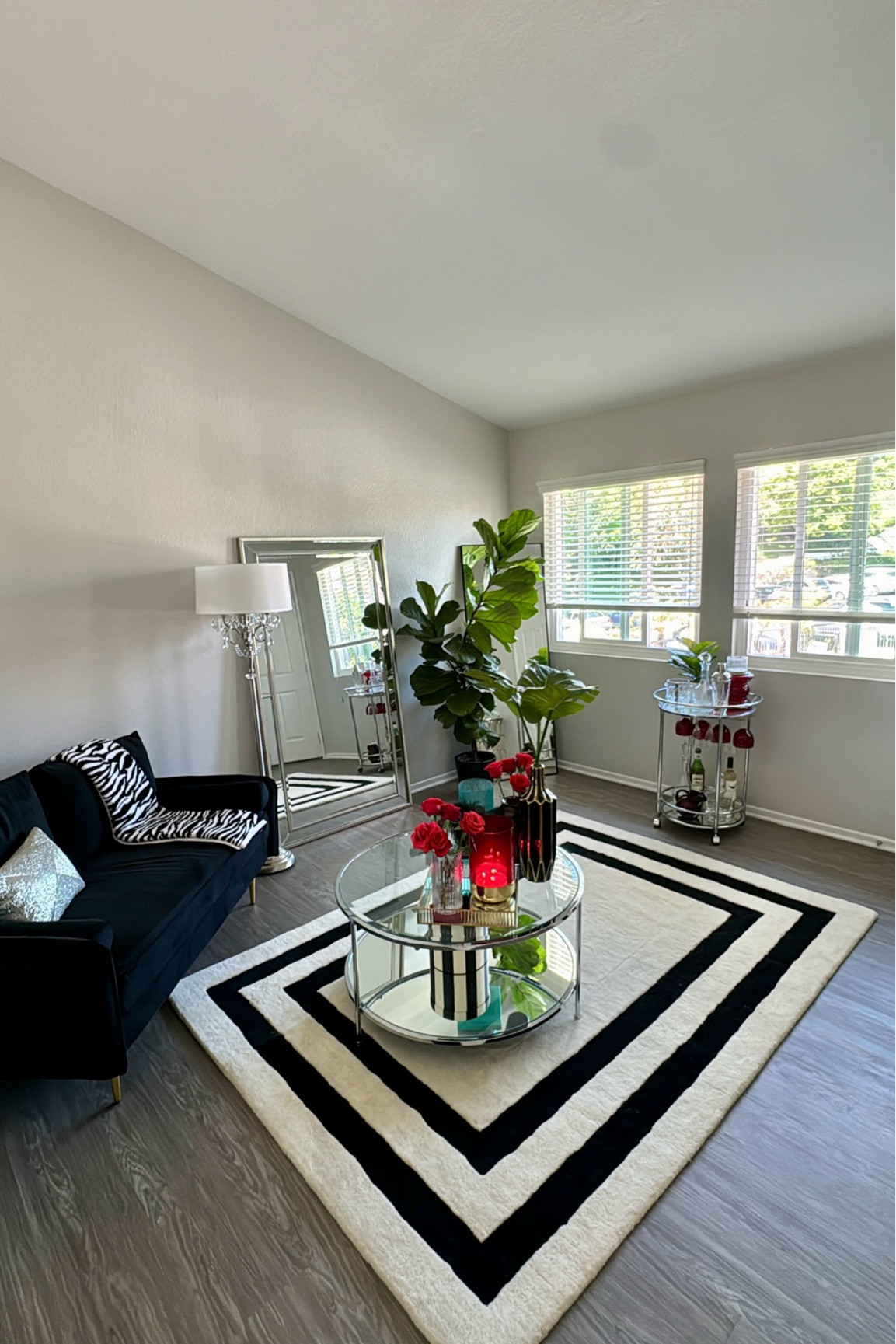 Living room decor🪞🪴✨ Some items are on sale. Everything is linked!!
Interior design 
Apartment decor 
Home decor
Small space decor 
Art deco style
Art deco home
H&M home rug 
Area rug 
Couch is from Wayfair 
Coffee table is from Wayfair 
Barefoot dreams blanket 
Z Gallerie bar cart
The silver mirror is from Kirkland’s 
The mirror in the corner is from Amazon 
Crystal lamp is also from Amazon  

#LTKHome #LTKStyleTip #LTKSaleAlert