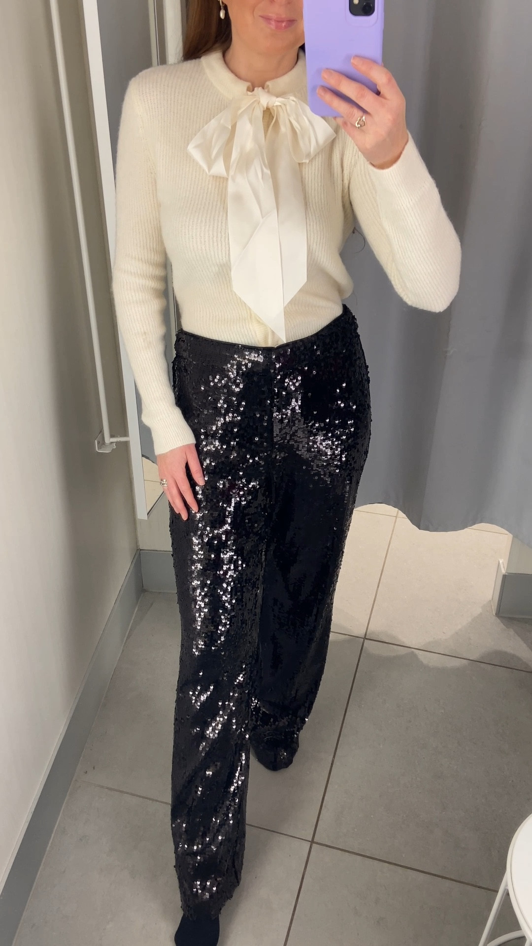 New in H&M Party 💃🏻🍸 Such a perfect Christmas cocktails look this cream bow-detail knit paired with the black sequin wide-leg trousers is so chic and festive. Team it with heels and you’ve got the ideal holiday party outfit. I’m wearing an XS in the top and a UK 10 in the trousers. Christmas outfits, sequin trousers, party outfits, sequins, Christmas party outfits 

#LTKpartywear #LTKfestive #LTKuk