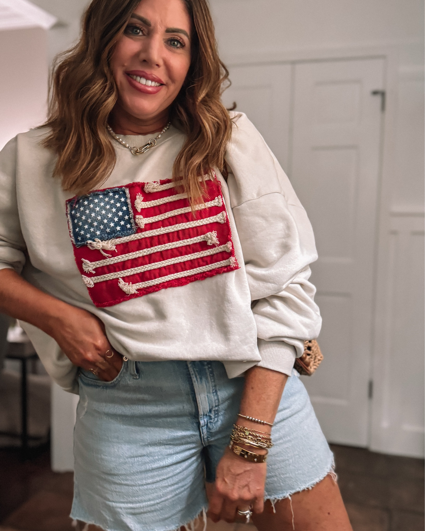 The perfect sweatshirt for summer!! It’s a free people look for less & it’s so good!! I sized up to an XL cotton/poly blend.

These denim shorts are high-rise with the perfect amount of stretch slips on the side and magic pockets which smooth your stomach they come in other washes but this wash is my favorite available in classic and curvy fit. I am wearing a 29.

My favorite sandals from Dolce Vita they are super comfy and true to size

And this cute little bag is also from target such a good bag for summer and it’s a perfect every day size looks and feels so expensive

#LTKOver40 #LTKootd #LTKSaleAlert