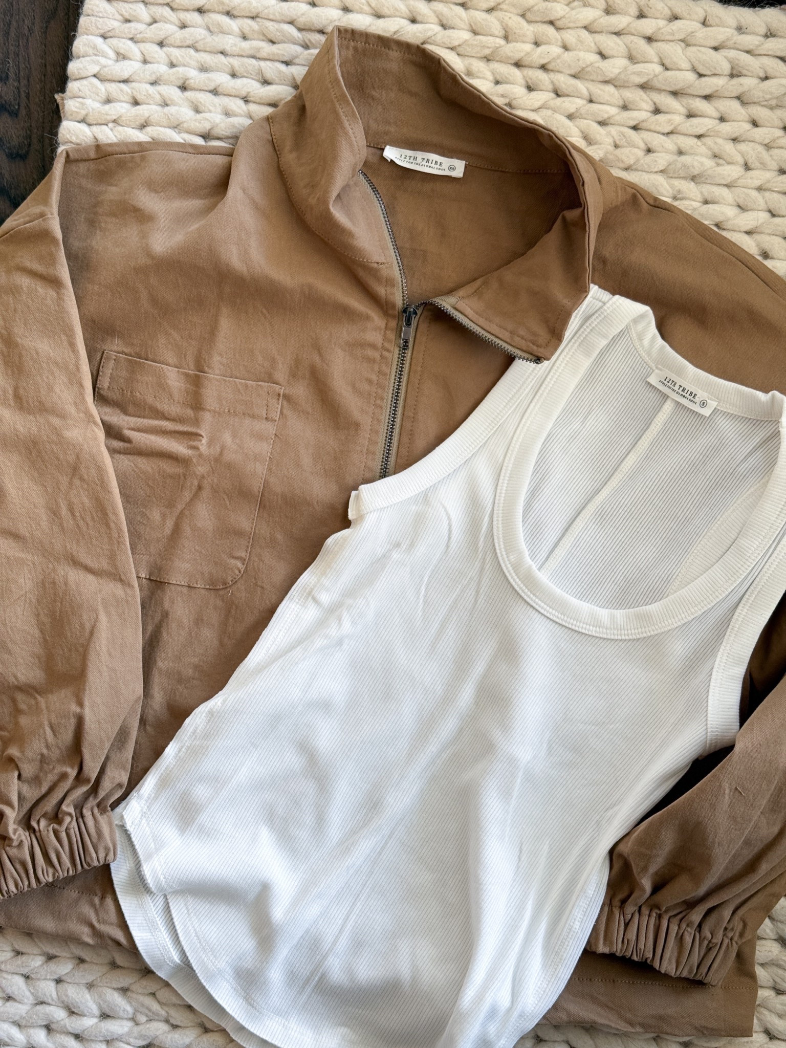 Two 12th Tribe pieces that are going to get a lot of use this season. This oversized zip up jacket is so versatile & the white ribbed tank underneath is the kind of basic that actually earns its closet space. Together they are a really easy outfit & separately they both work with just about everything I already own. Both are linked on LTK. @12th Tribe 

12th Tribe jacket - 12th Tribe tank - 12th Tribe outfit - zip up jacket women - camel jacket - tan zip jacket - ribbed tank top - white ribbed tank - casual spring outfit - transitional weather outfit - neutral outfit ideas - elevated basics - quiet luxury outfit - camel & white outfit - layered outfit idea - zip up bomber jacket - women’s utility jacket - spring jacket women - LTK fashion finds - LTK spring style - everyday outfit ideas - casual chic style - neutral wardrobe staples - outfit inspo women - simple style finds​​​​​​​​​​​​​​​​

#LTKootd #LTKU #LTKvlog
