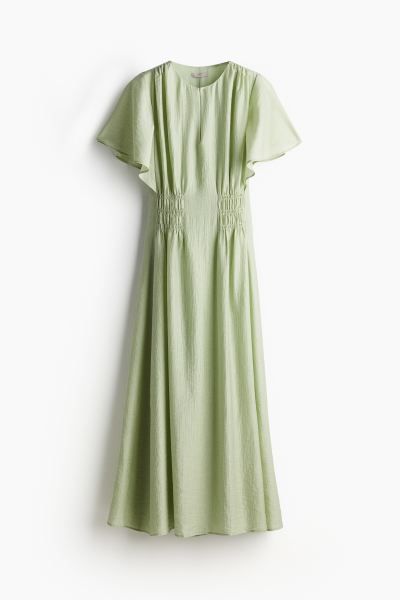 Long smock-waisted dress - Pistachio green - Ladies | H&M GB | H&M (UK, MY, IN, SG, PH, TW, HK)