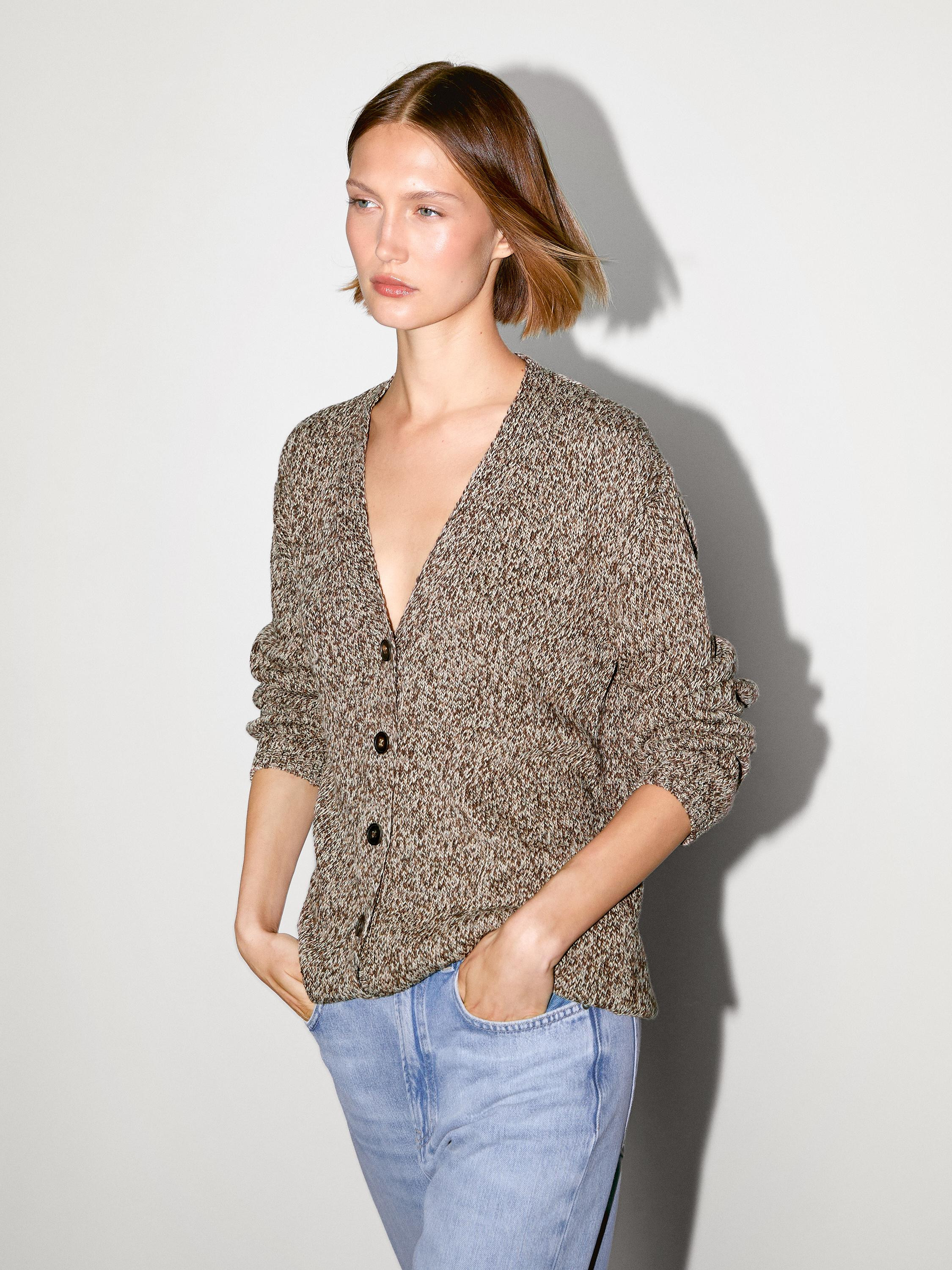 Cardigan made of knitted fabric with 100% cotton. V-neck . Long sleeves. Button fastening. Made i... | Massimo Dutti UK