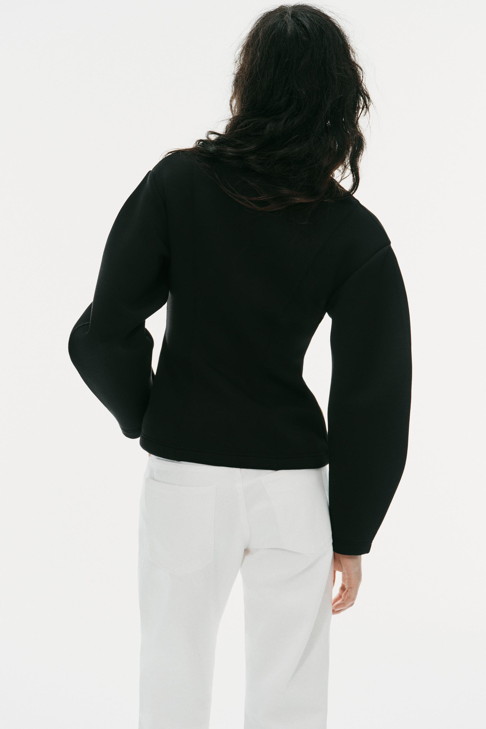 Jacket with a raised collar and long sleeves. Featuring front pockets and a hidden front button f... | Zara UK