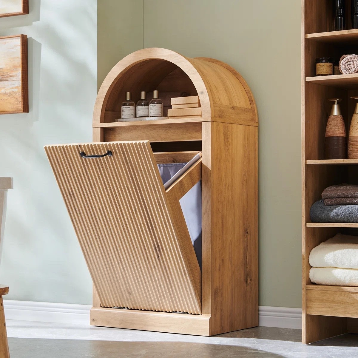 This modern tilted laundry basket cabinet doubles as a laundry hamper for dirty clothes, storage unit, or trash bin. Its open top shelf provides convenient storage for bathroom essentials. With a 10-gallon capacity (including soft basket), the tilted design conceals contents and prevents odors, keeping your bathroom fresh.

What's Included?
Removable Liner/ Bag

#bathroomessentials #wayfair #wayfairfinds 

#LTKHome