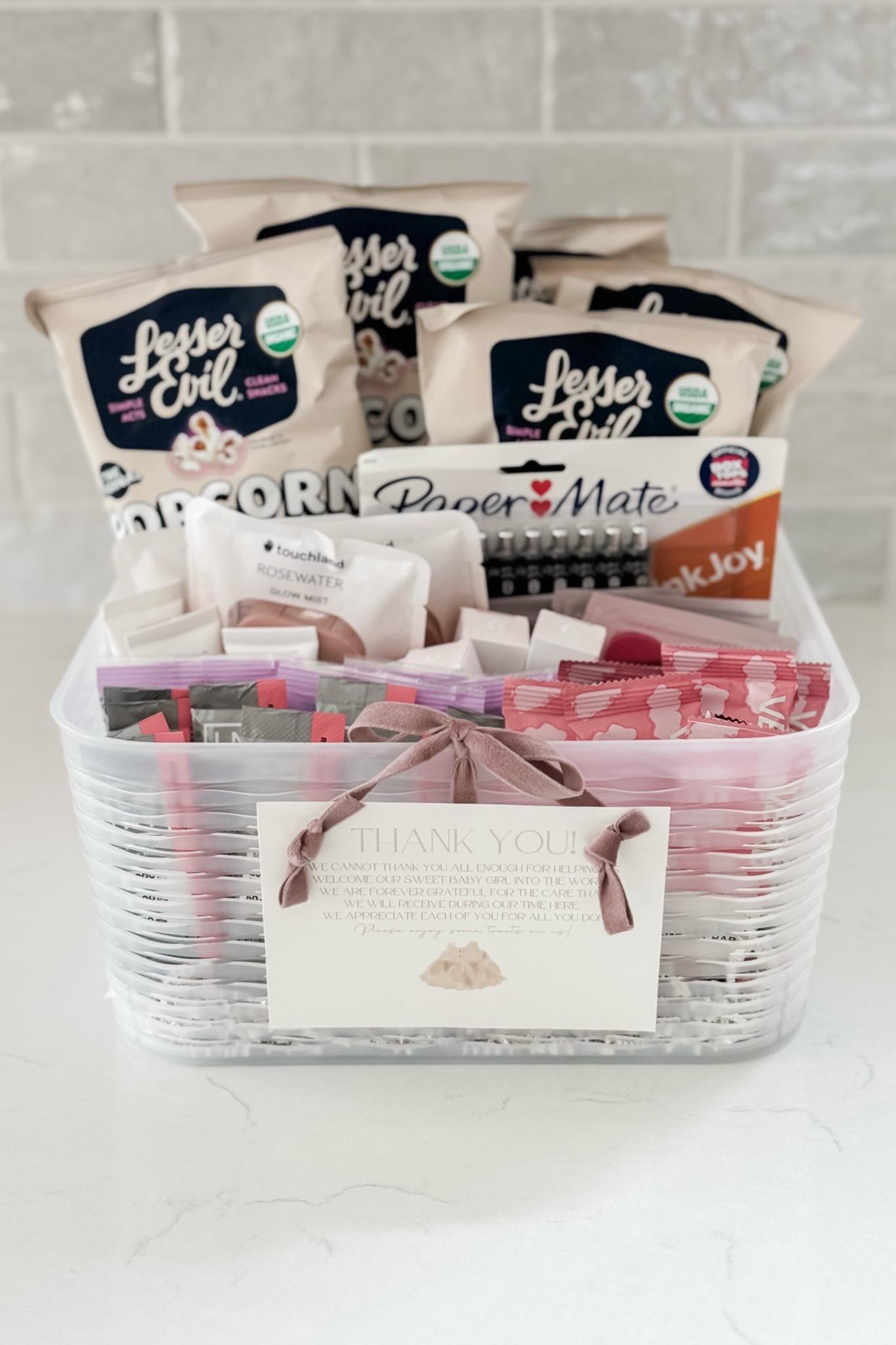 Sharing what I put in our Labor & Delivery Nurse Thank-You Baskets! I tried to do a mix of snacks and non-edible options so that the nurses can choose what they want out of it. Obviously, I went with a pink theme for Baby Girl! 🎀💕
(I know the hand sani and lip balms are a bit pricey, but I scored them at a lower price during the Sephora sale and only got 3 of each product for both baskets). 

#LTKGiftGuide #LTKBump #LTKBaby