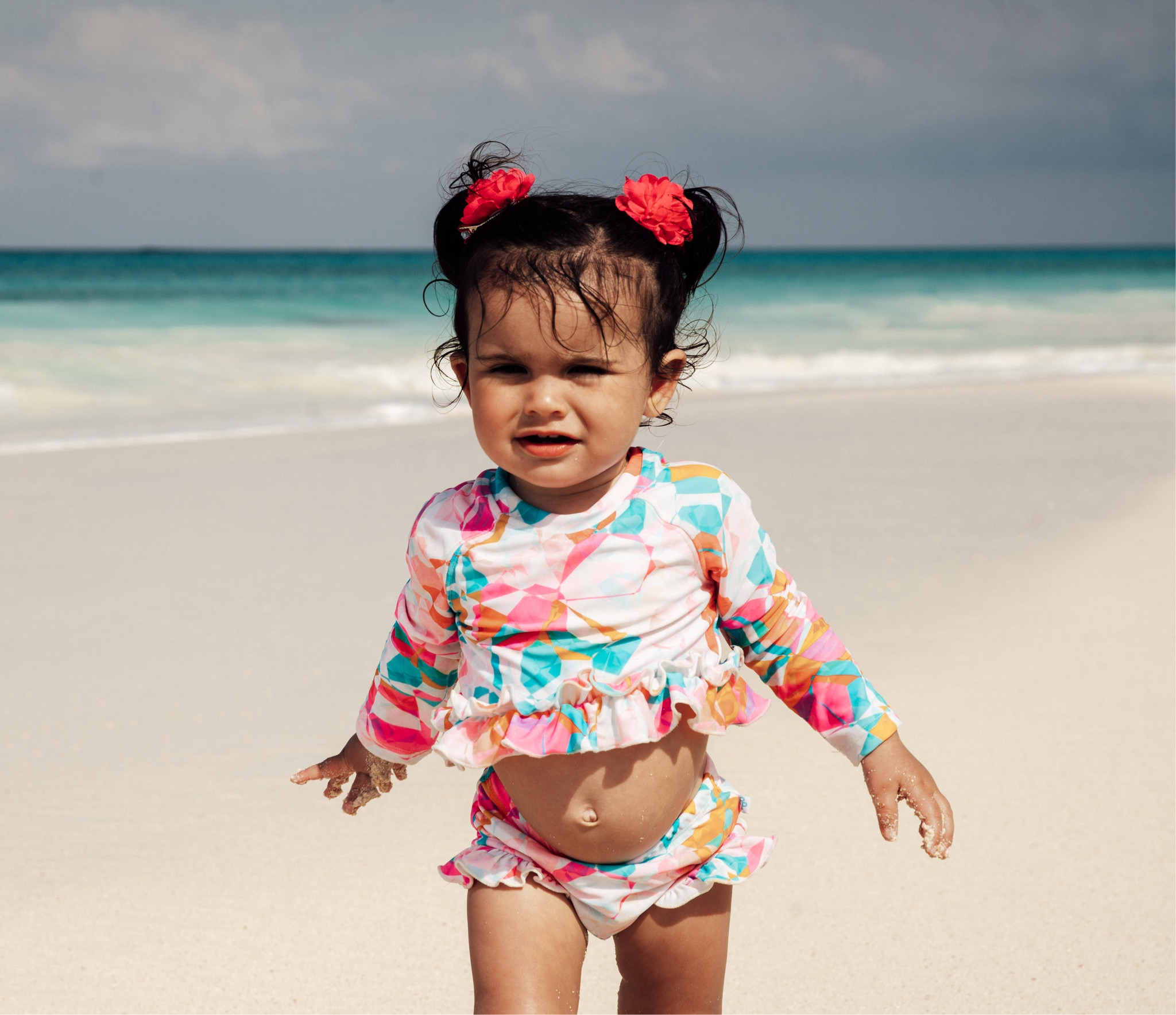 My little baby giving serious beach vibes. Loving this geometric shaped print two piece from Posh Peanut! We also have the tank version of this tankini as well as the rash guard!

#LTKswim #LTKbaby #LTKtravel