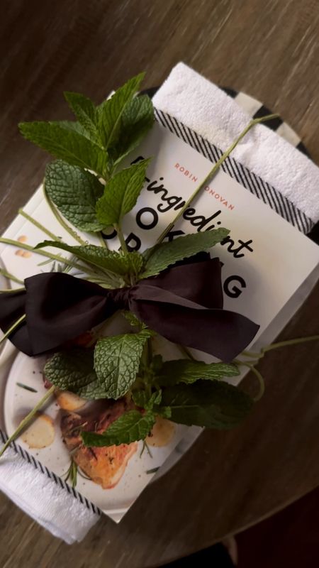 Bridal shower gift idea… a beautiful board, layered with dish towels layered with a cookbook.  All tied together in a bow with some herbs on top! No need to use gift wrap! 

#LTKVideo #LTKHome #LTKFindsUnder50