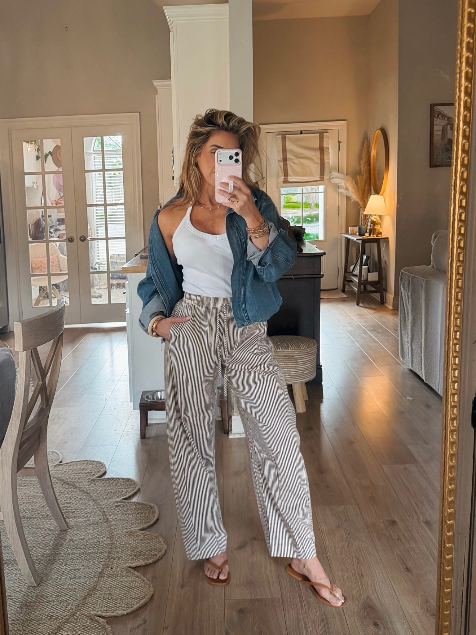 I’ve been wearing a lot of elastic waist comfy loose pants with tank tops this month. I throw on a cute cropped jacket for the indoor A/C chill.

Fall outfits women, barrel leg pants, chocolate brown stripe pants, denim bomber jacket, white tank top, sandals, fall transition outfits

#LTKootd #LTKdayinmylife #LTKOver40