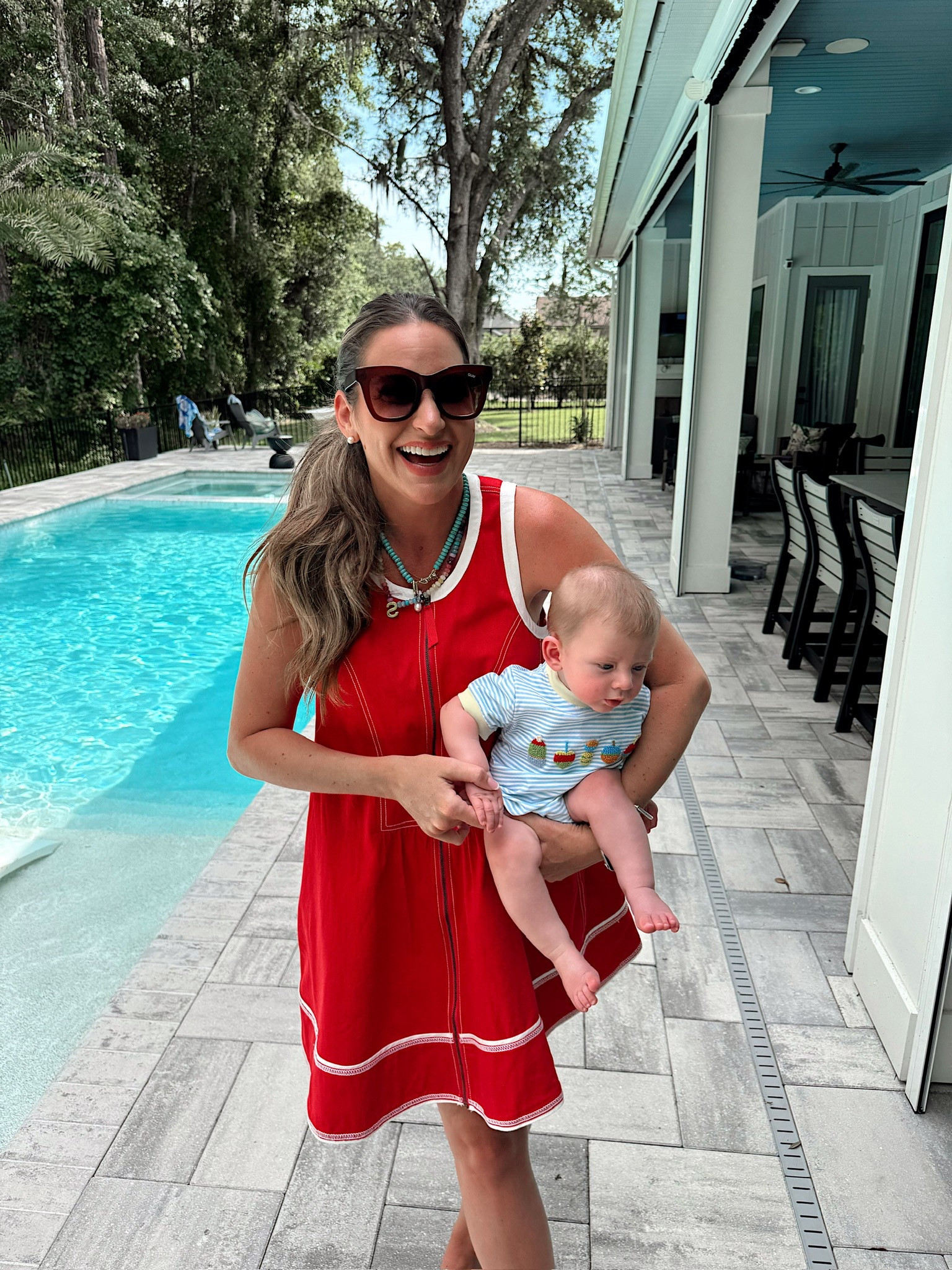 In a small zip front denim mini dress, necklaces, sunglasses, sandals and accessories - fits tts. Storms outfit from the Smocked Flamingo linked!

#LTKStyleTip #LTKSeasonal #LTKBaby