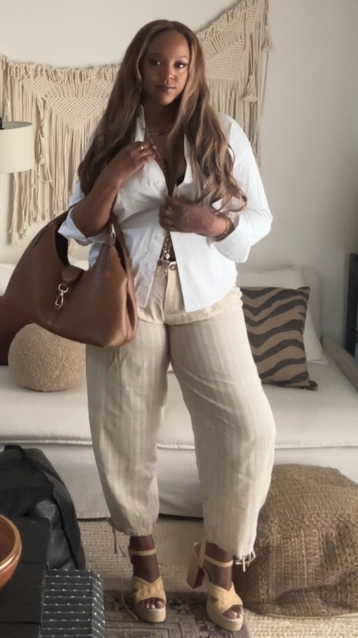The Perfect Neutral Uniform for Spring 🤍✨
If you’re looking for a look that feels elevated but takes zero effort, this neutral tonal outfit is it. I’m obsessed with mixing textures. The crispness of a white button-down paired with the relaxed, airy feel of these balloon-style trousers is a match made in heaven.
I styled it open over a simple base to keep it breezy. It’s a wardrobe staple you’ll use year-round.
These cream balloon trousers are the star. They have that perfect oversized, architectural shape that feels so high-end but is incredibly comfortable. ( I sized down but should have gone with my true size) 
I paired this with a structured tan hobo bag to bring in some warmth and chunky platform sandals to give the wide-leg silhouette some height.
Style Tip: Keep the colors within the same palette (whites, creams, and tans) to make an affordable outfit look instantly "quite luxury."
#NeutralAesthetic #CoastalGrandmother #SpringOOTD #QuietLuxury #OldMoneyStyle #CapsuleWardrobe #LTKUnder100

#LTKWorkwear #LTKTall #LTKMidsize
