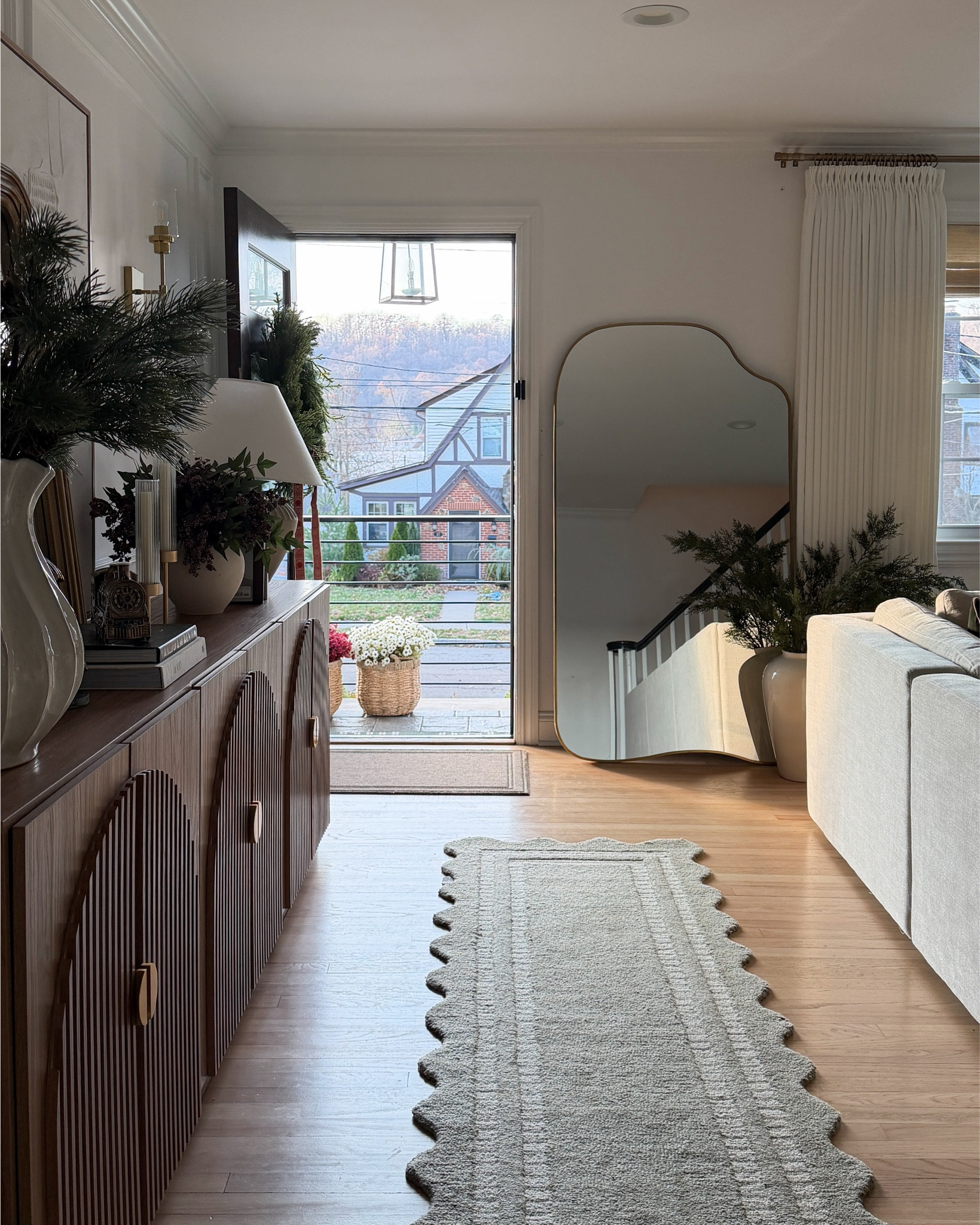 This little entryway + console table moment makes me pause every time — warm wood tones, simple greenery, and that quiet holiday glow that feels calm instead of overdone. I love how this console anchors the space and is so easy to style season after season. 🤎🌲



#LTKHoliday #LTKSaleAlert