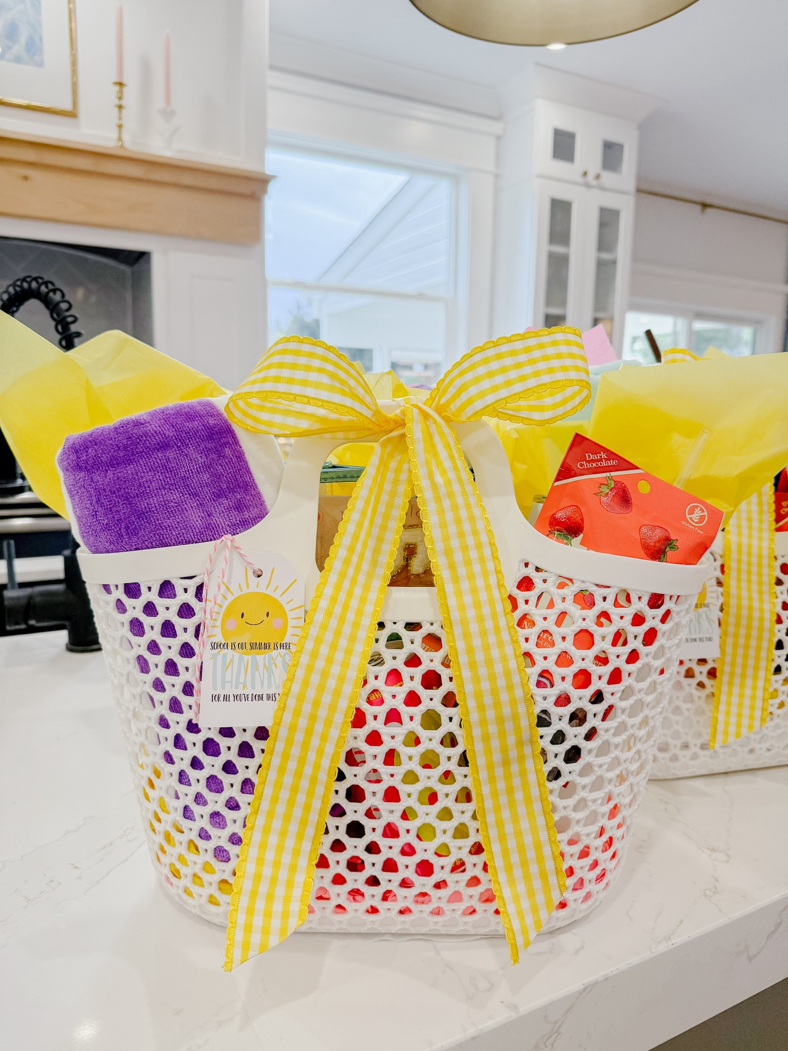 Teacher gift summer theme gifts baskets. & the thank you tag is bought in bulk and comes printed! 

Inside: towel, a tumbler filled with candy, snacks, a few cans of poppi, a sunscreen waterproof pouch (inside of pouch:  a facial sunscreen stick, a couple of eye masks sheets, a flip-flop bottle opener & a visa gift card )