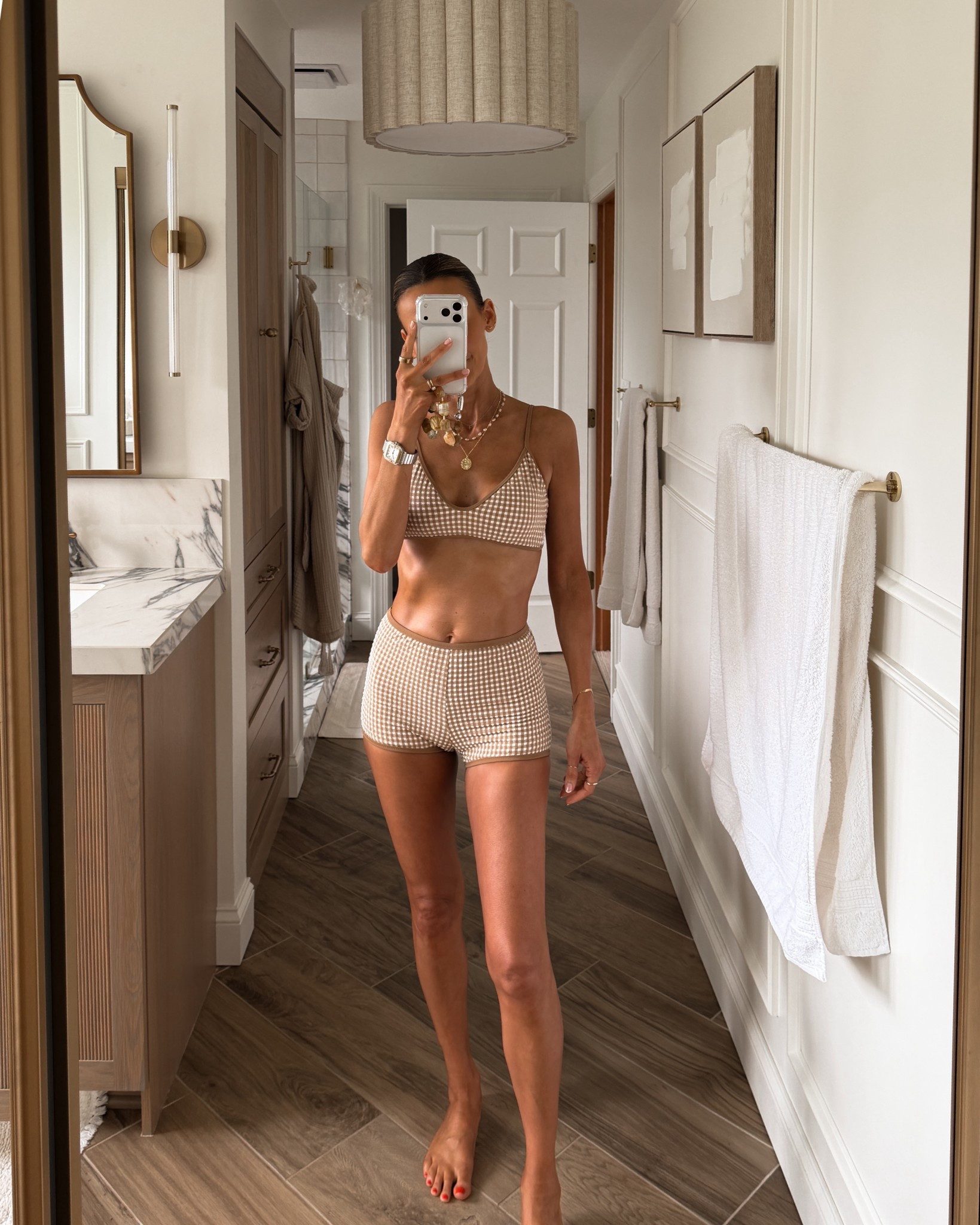 Loving this boy short bathing suit style in gingham- size small. Linking the matching sjirt I got to wear together 

#LTKSwim #LTKOver40 #LTKSeasonal