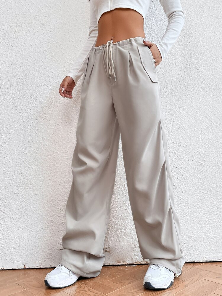 SHEIN EZwear Solid Drawstring Waist Parachute Pants
       
              
              $17.49  ... | SHEIN