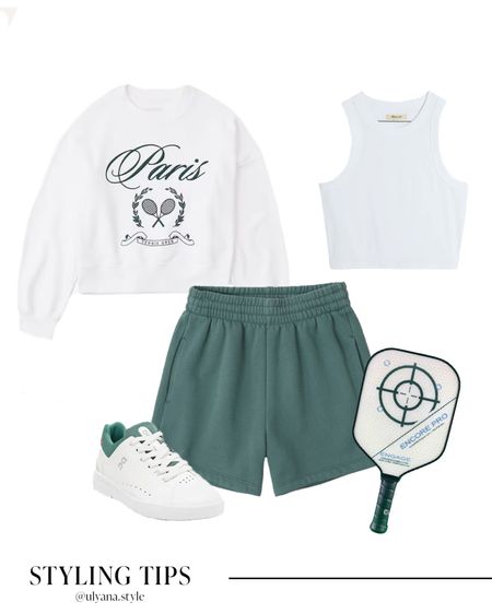 A graphic sweatshirt paired with shorts, white tank top, and sneakers makes a cute pickle ball or casual athleisure outfits. 
.
.
.
.
.
.
.
Casual outfits | pickleball outfit | pickleball paddles |  athletic wear | shorts outfit | athletic shorts | Abercrombie shorts | comfy shorts | casual shorts | green shorts | high waisted shorts | lounge shorts | sweatshirt outfit | white sweatshirt | crewneck sweatshirts | sneakers women | white sneakers | Nordstrom | summer outfits | summer tank tops | summer tops | outfit ideas | outfit inspo | 
#LTKSeasonal #LTKFind #LTKU #LTKcurves #LTKitbag #LTKsalealert #LTKshoecrush #LTKstyletip #LTKtravel #LTKunder50 #LTKunder100 #LTKfit