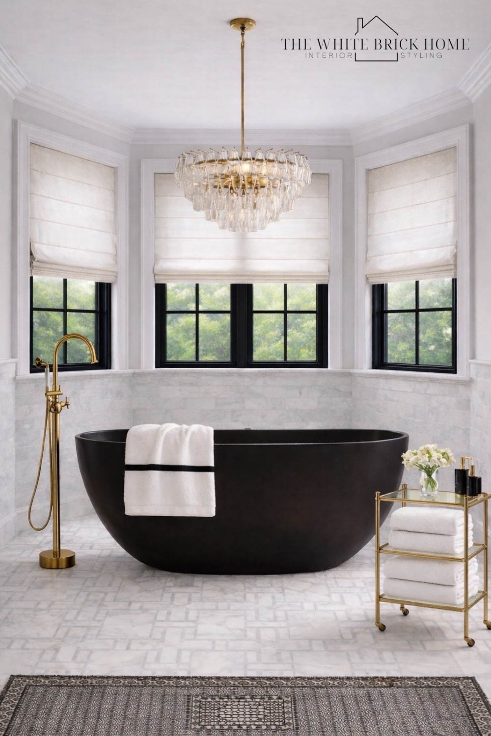 A bold black soaking tub paired with warm brass accents and timeless marble creates a spa level bath that feels luxe and modern classic. 
🖤🖤
Bath, bathroom, primary bath, primary bathroom, bathroom decor, bathroom design, black and white bathroom, bathroom ideas, bathroom design, chandelier, towels, bathroom decor ideas, bathroom table, marble bathroom, bathroom tile, bathroom flooring, bathroom decor ideas, bath, bath tub, bathroom ideas, wayfair, pottery barn, crate and barrel 


#LTKHome #LTKSaleAlert #LTKSeasonal