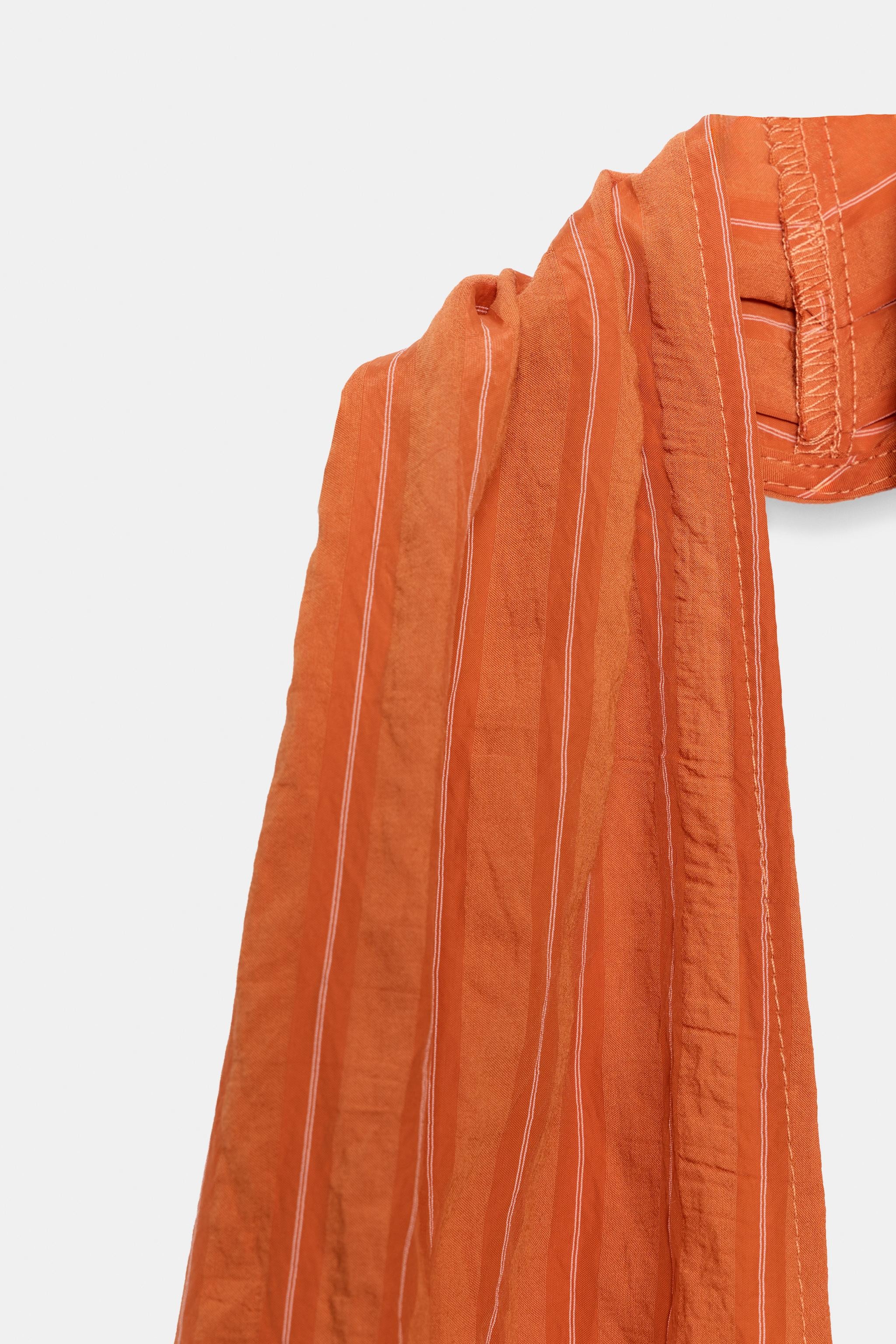 Halter neck top with a plunging V-neckline. Features a matching sash tie in the same fabric. | Zara US