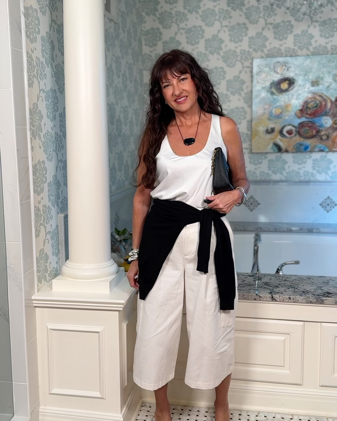 White culottes styling part 2! Low cut satin top is on trend this spring and summer! Wrap sweater around waist rather than shoulders for a more current look! Shorts are @Zara and selling out fast! All white with black accessories is the look of the moment!

#LTKOver40 #LTKootd