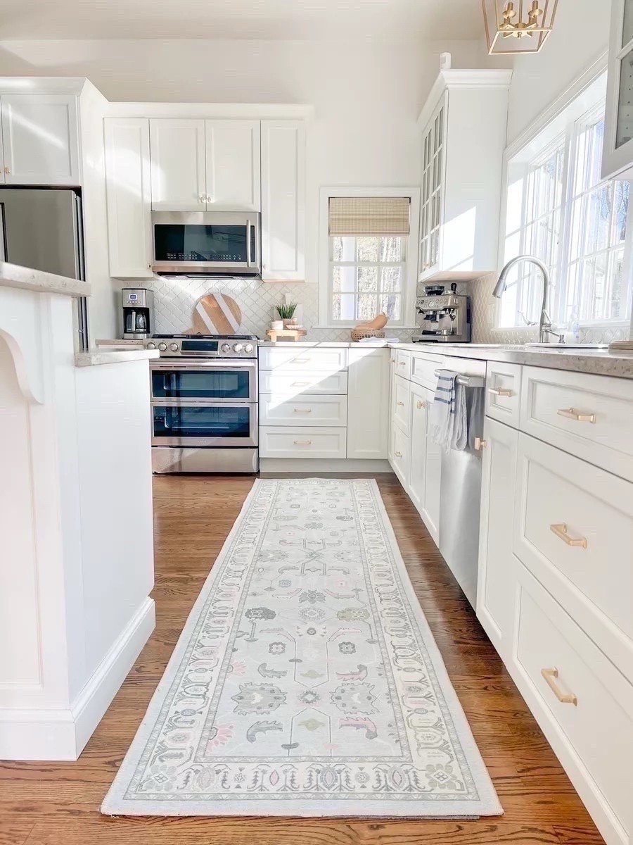 This kitchen runner is available in most standard rug sizes, is well priced, AND it's washable!! My woven shades are the Capri Ivory color. 
----
Amazon Kitchen runner, woven blinds, woven shades, kitchen decor, home decor, coastal kitchen, coastal styling, coastal home deco, Amazon runner rug, Amazon kitchen rug, Amazon coastal rug, affordable rug, washable rug, coffee maker, cuisinart coffee maker, glass soap dispensers, Amazon reusable soap dispensers, home, kitchen, neutral home, neutral kitchen, storage bag organizer, wooden organizer, bamboo expandable drawer organizer, antique brass cabinet pulls, beach house style, beach home, coastal style, Amazon rugs, Amazon rugs, blue and white runners, coastal Amazon decor

#LTKHome