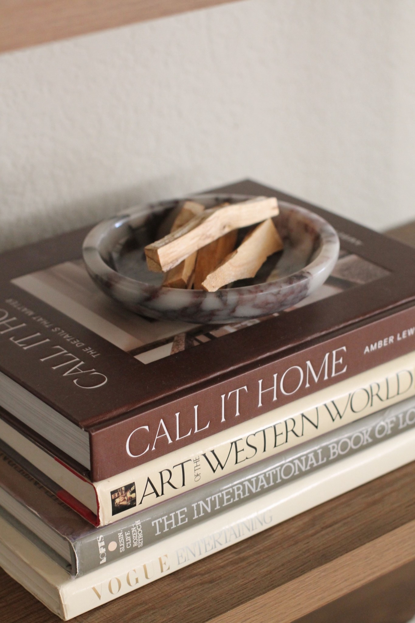 A cozy little vignette moment 🤎
Layered coffee table books topped with a marble dish and palo santo—simple, soulful, and intentional. This styling adds warmth, texture, and a quiet ritual vibe to any shelf or table. Perfect for lovers of slow living, earthy decor, and thoughtfully curated spaces. ✨

#cozyhome #coffeetablebooks #shelfstyling #neutraldecor #slowliving #earthyhome #intentionaldecor #homestyling #minimalwarmth 

#LTKHome