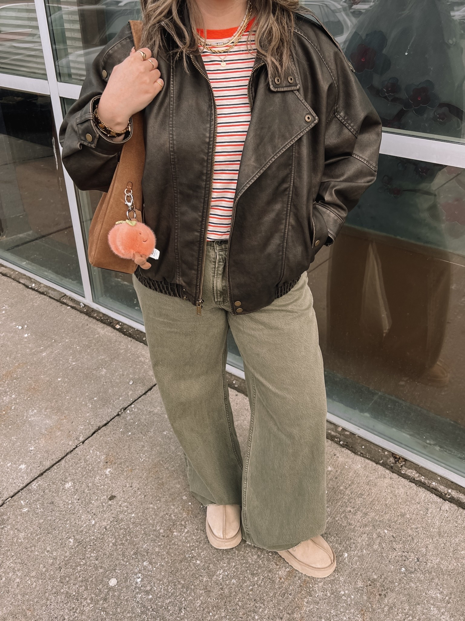 Easy spring outfit! Wearing my usual size L in the leather jacket. Sized up to XL in the striped tee since I have a larger chest and didn’t want it tight. Wearing 32 long in the olive jeans (the long length was a bit too long for me, reg was too short, so I cut the hem for a custom length! Ugg Tazz platforms fit TTS. I wear this coach bag constantly, and the jellycat peach bag charm is so fun for spring!


#LTKjeans #LTKmidsize #LTKstyletip